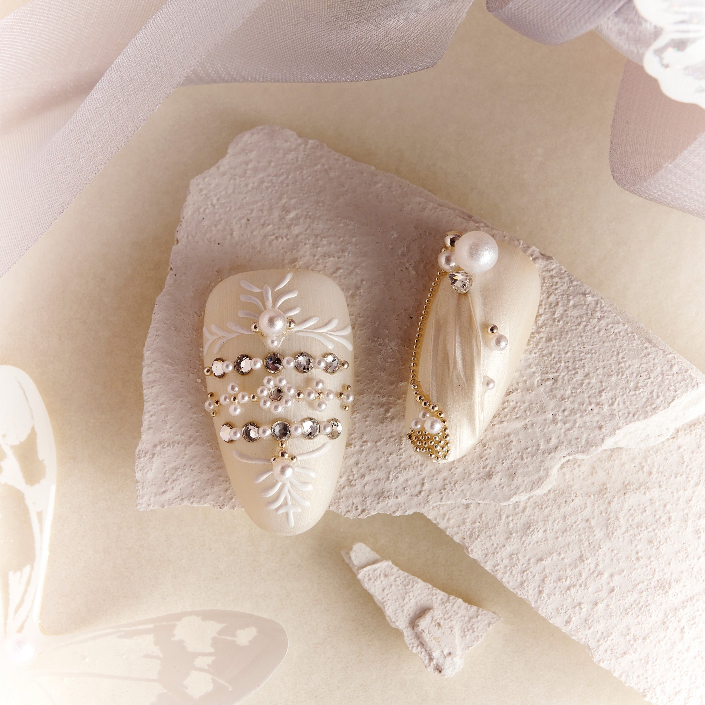 Luxury ivory wedding press on nails with pearl and crystal embellishments by BOXNAIL. Elegant cathedral-inspired bridal manicure set.