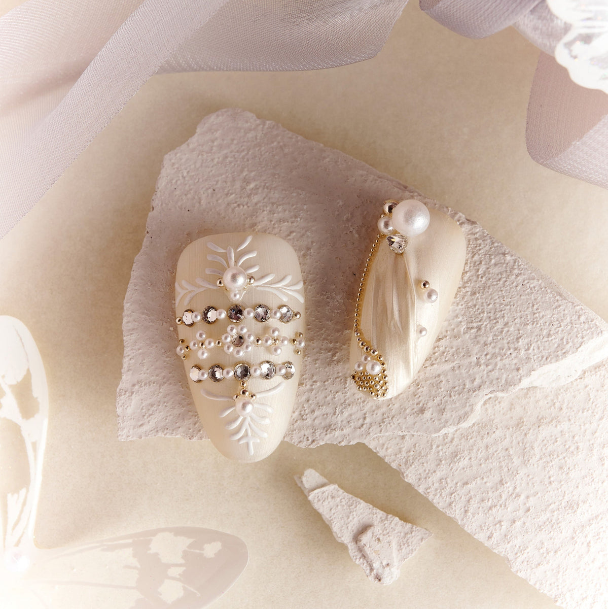 Luxury ivory wedding press on nails with pearl and crystal embellishments by BOXNAIL. Elegant cathedral-inspired bridal manicure set.