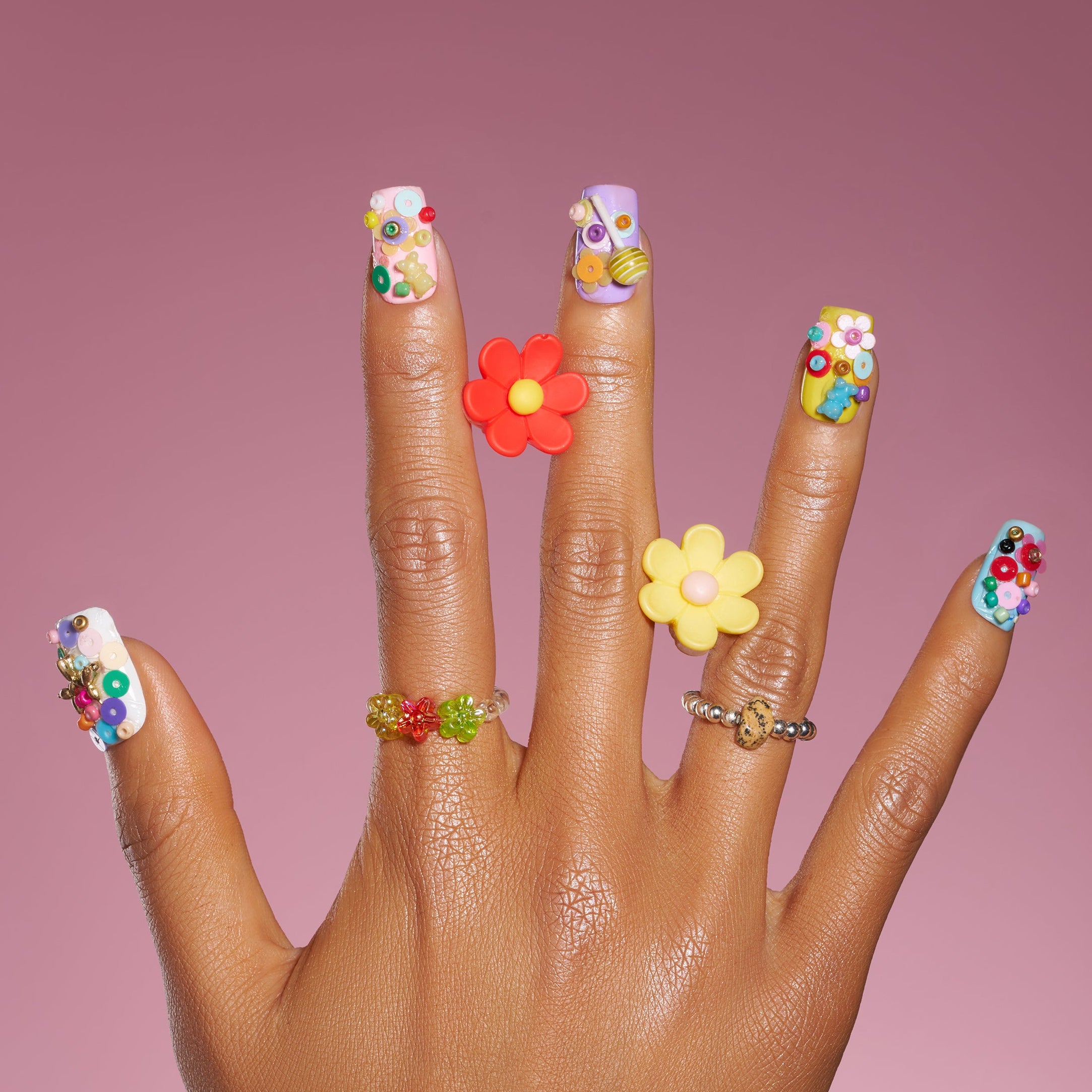 3D candy-inspired press on nails with beads and lollipop accents. Playful handmade nail set.