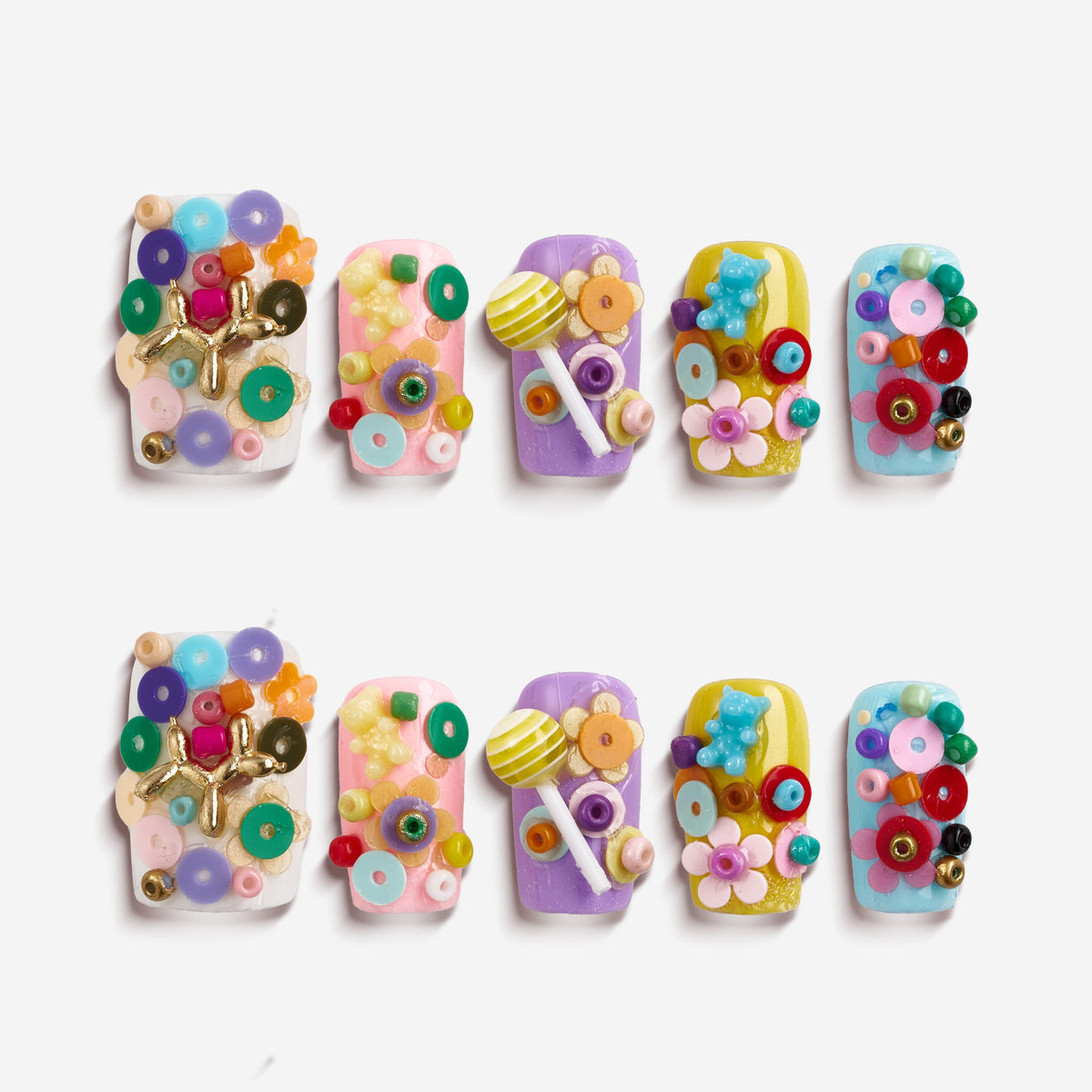 3D candy-inspired press on nails with beads and lollipop accents. Playful handmade nail set.