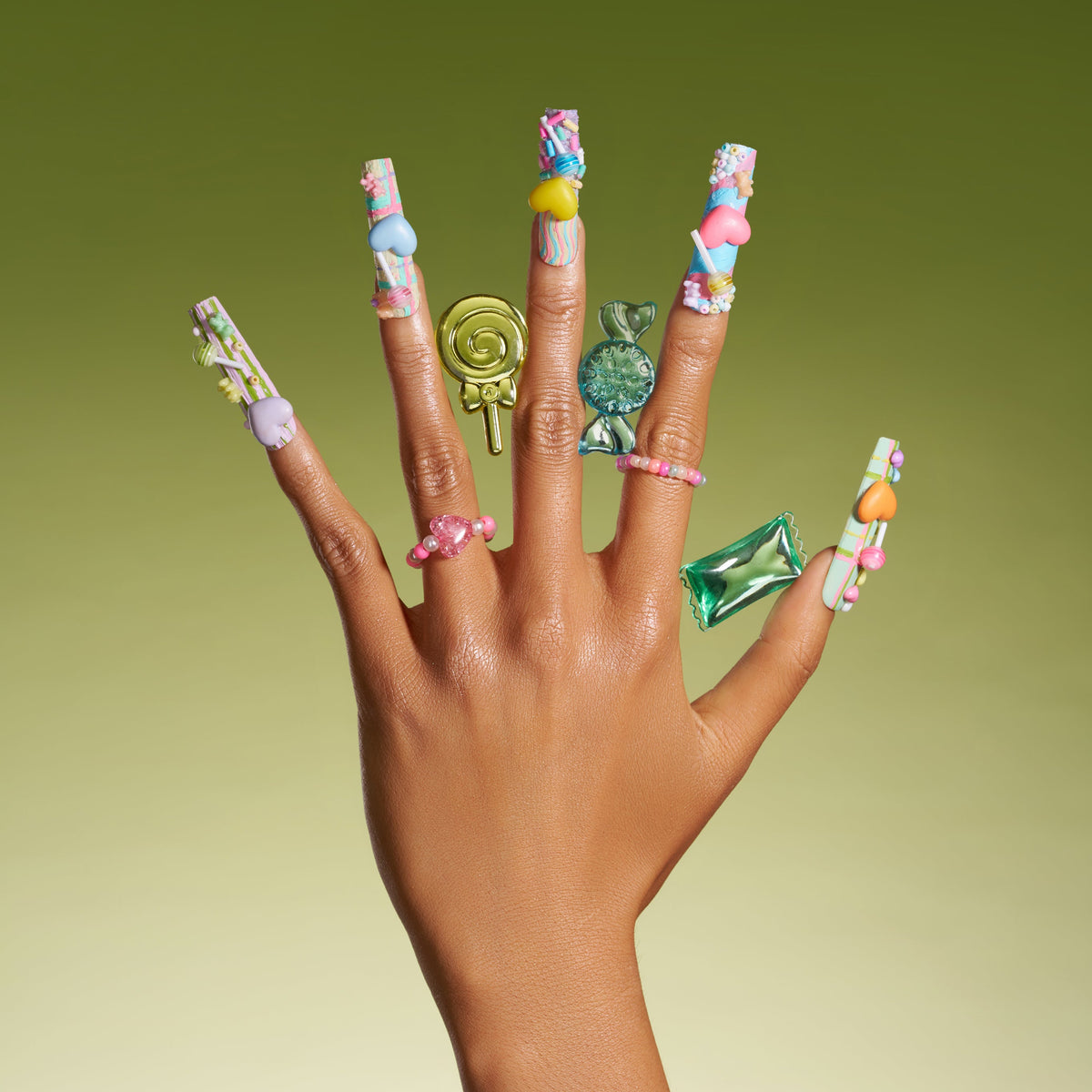 Playful 3D candy heart press on nails in pastel tones. Reusable Y2K-inspired nail art set.