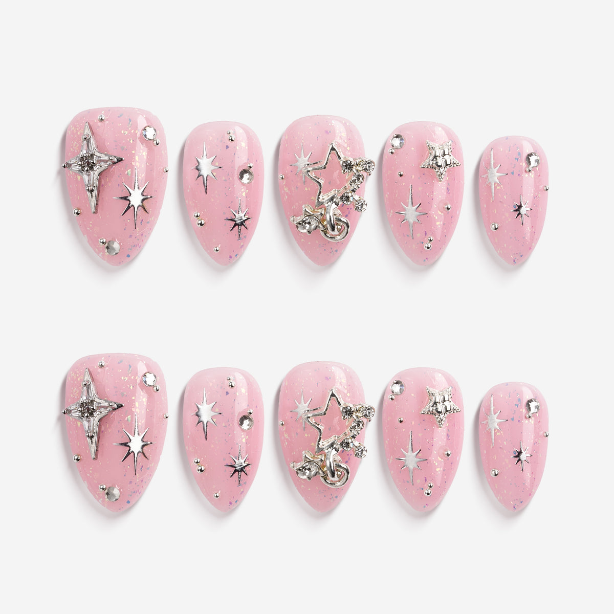 Dreamy pink glitter press on nails with star charms and crystal details. Soft glam and reusable.