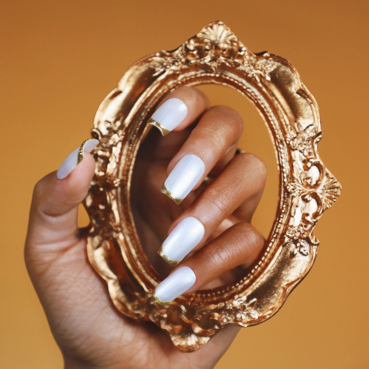 Champagne Fine Gold press on nails with soft shimmer and gold accent. Elegant bridal ready false nails.