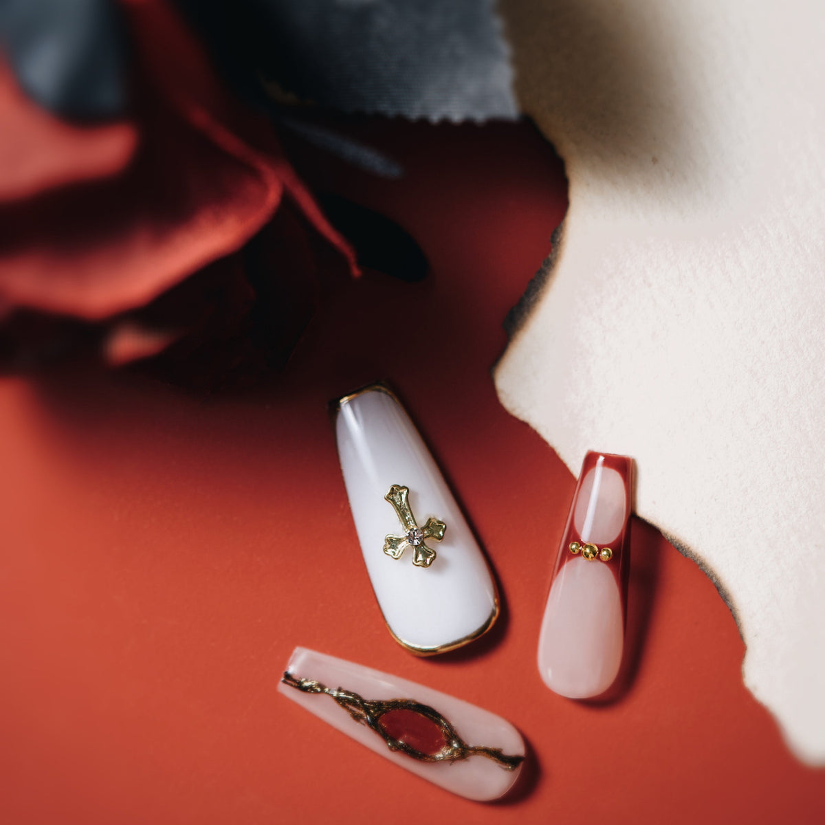 Almond red gradient press on nails with gold sculpted details. Elegant, bold and reusable.