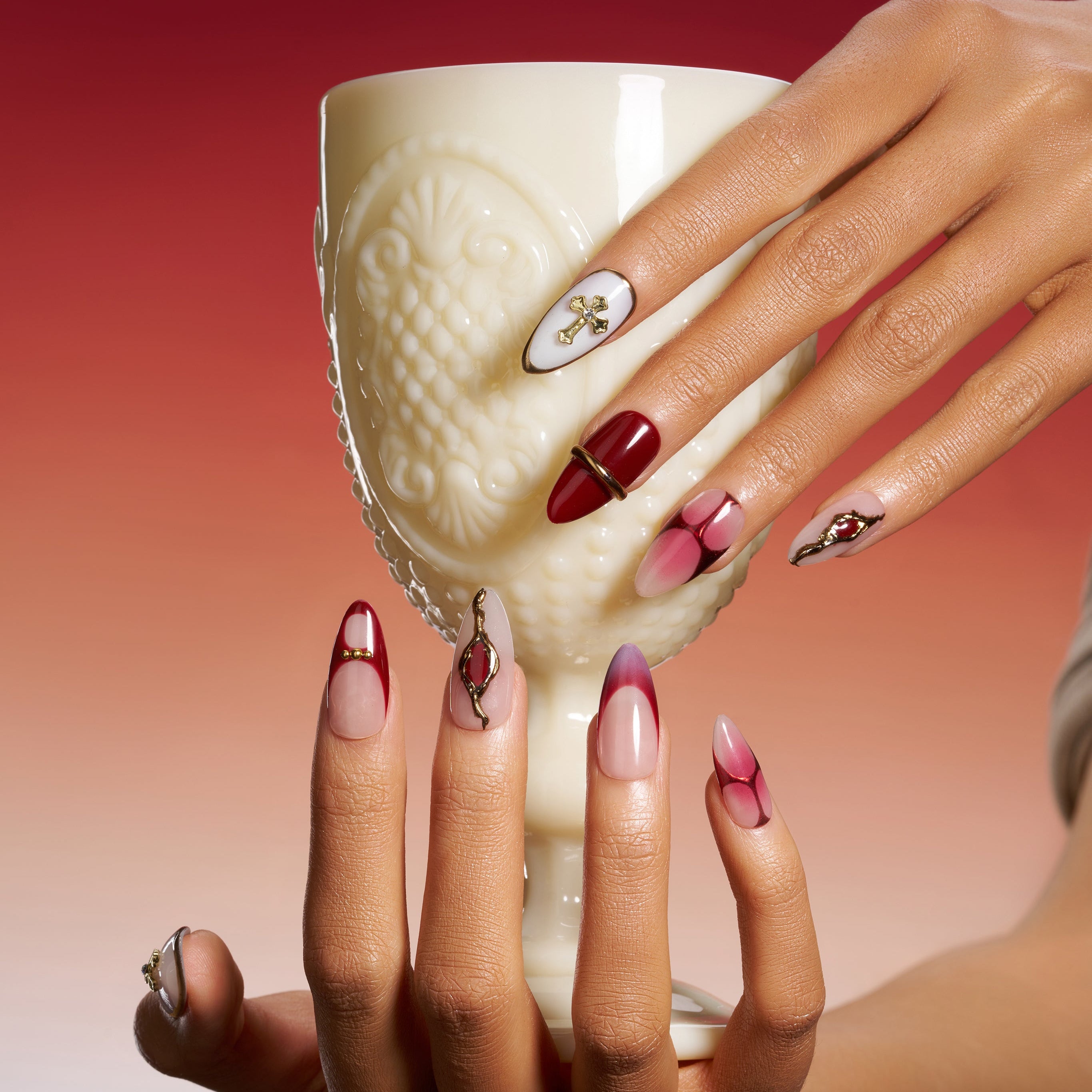 Bold red coffin press on nails with gold cross accents and gradient finish. Dramatic, elegant and reusable.