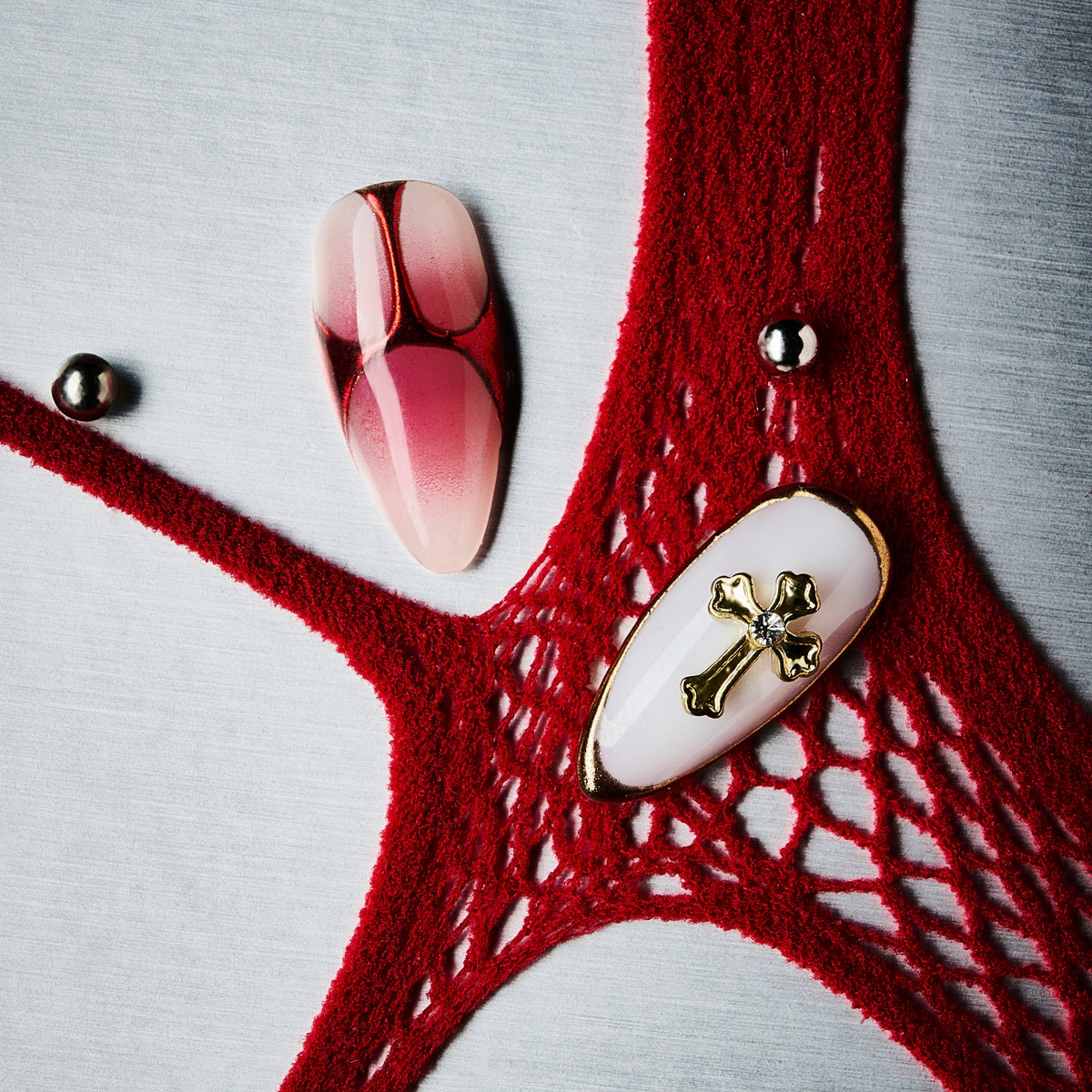 Bold red coffin press on nails with gold cross accents and gradient finish. Dramatic, elegant and reusable.