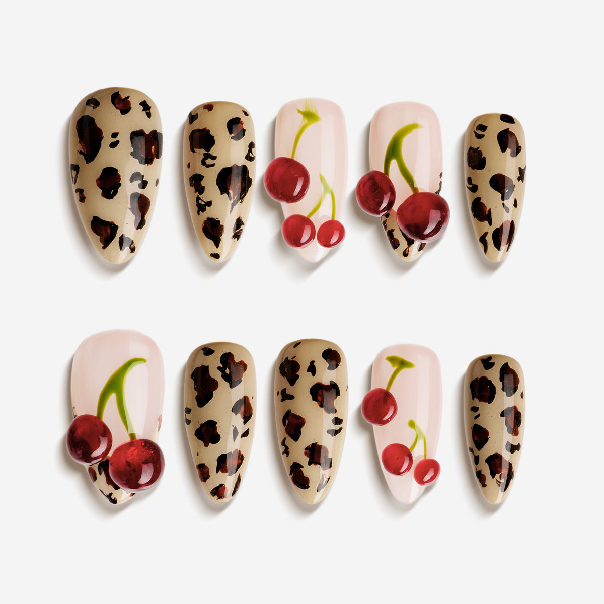 Almond press on nails with cherry art and brown leopard print on nude and pink base