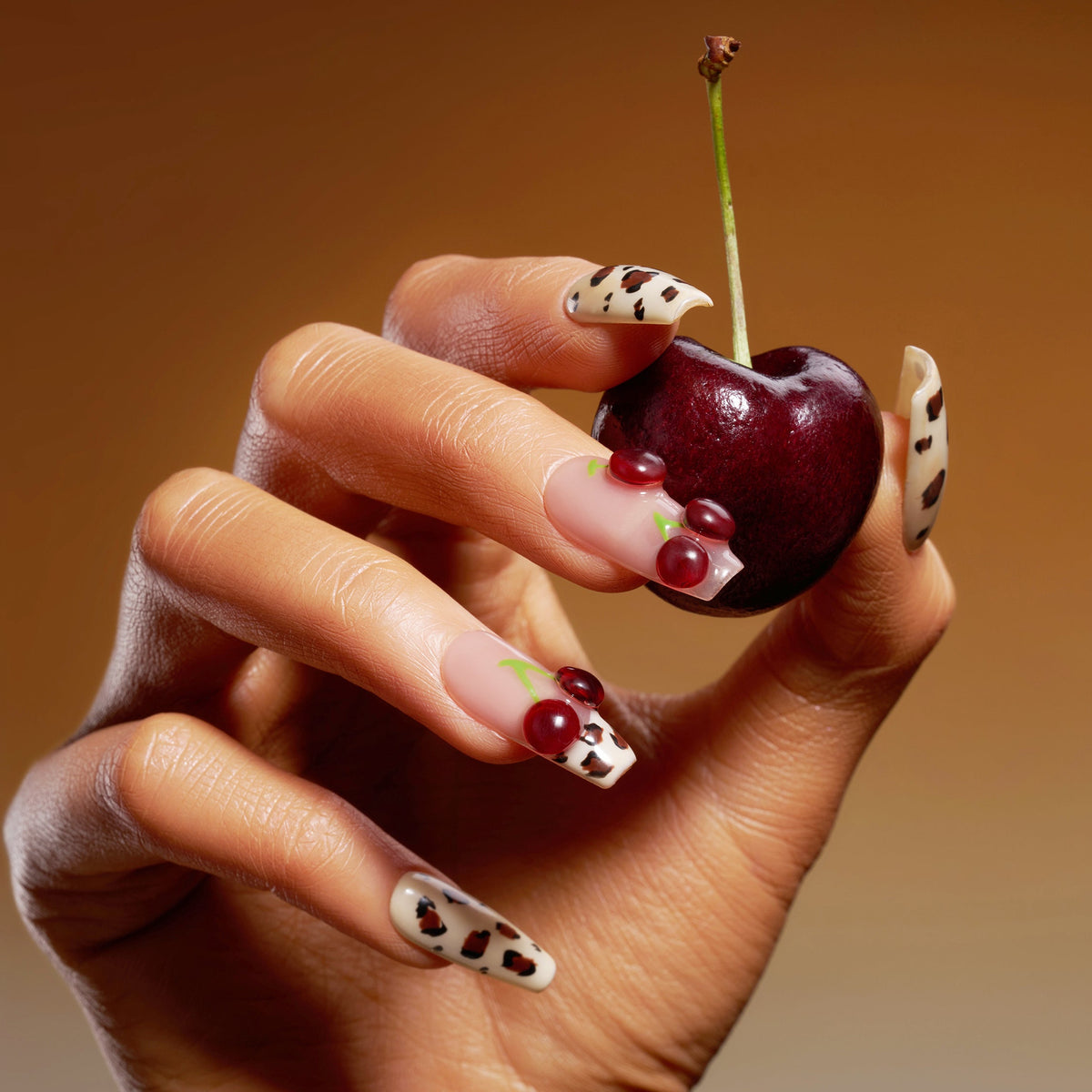 Coffin press on nails with cherry art and brown leopard print on nude and pink base