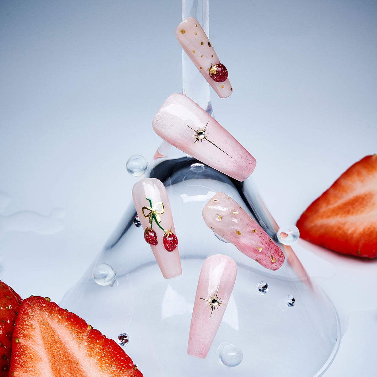 Cherry Glow nude press on nails with cherry accents and glossy finish