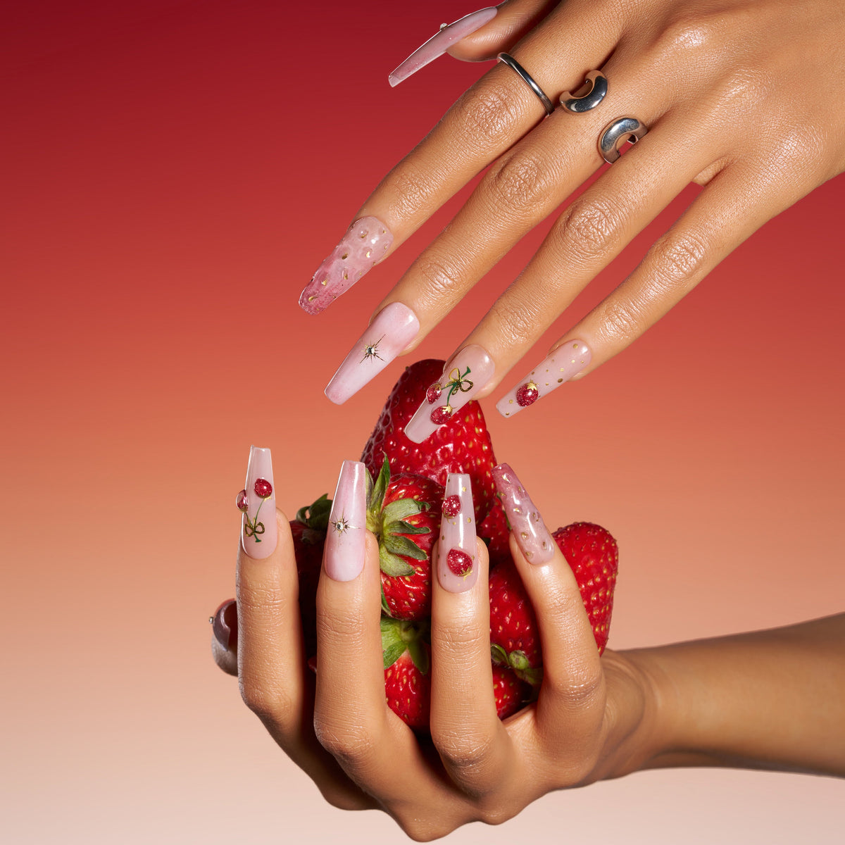 Cherry glow press on nails featuring glossy fruit accents. Elegant almond shape and reusable comfort fit.