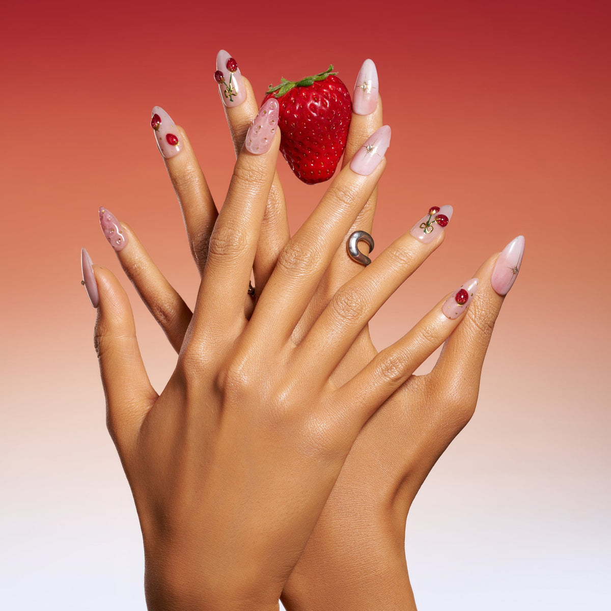 Short cherry press on nails with glossy shine and gold accents. Cute, stylish and reusable.