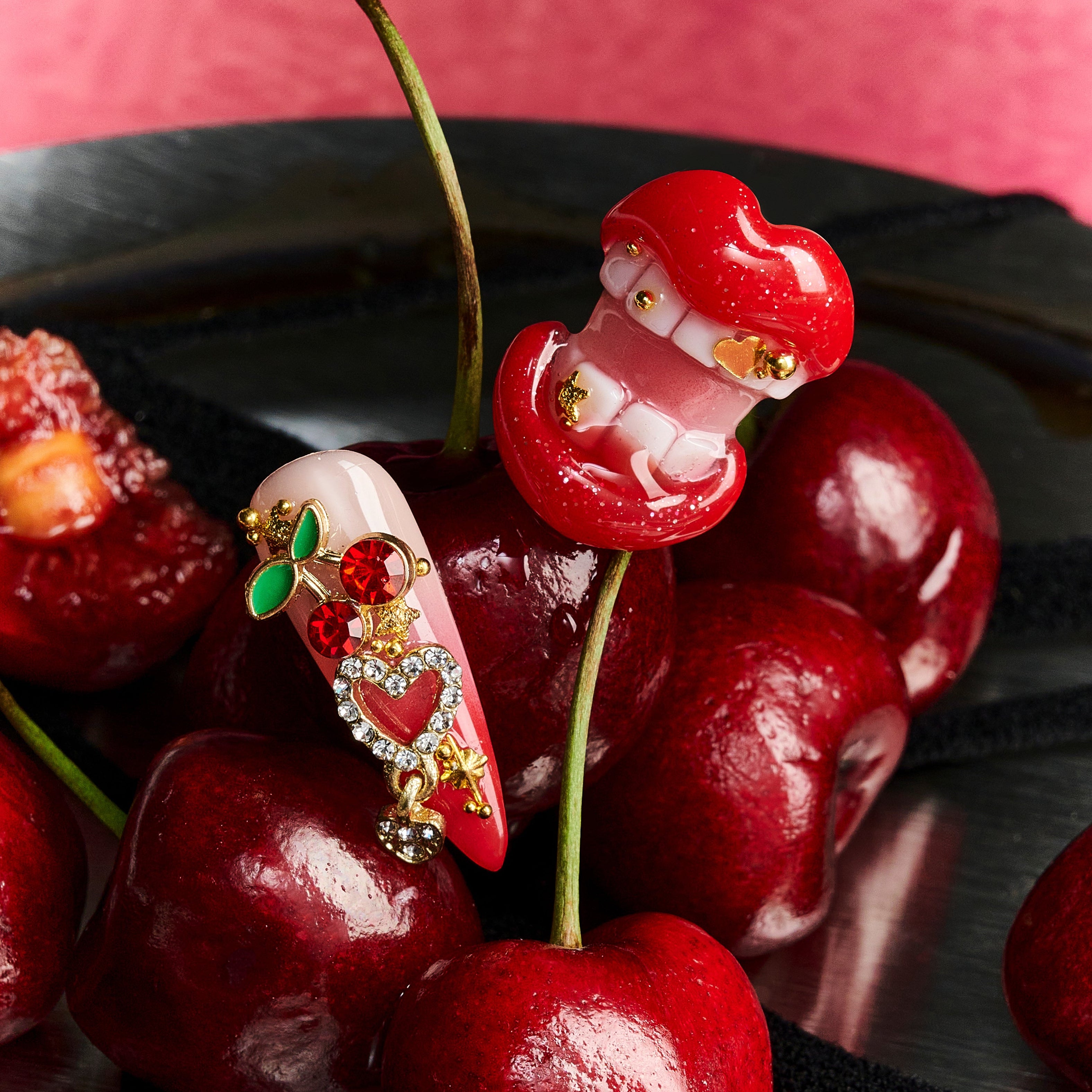 Press on nails with 3D red lips, cherry charm, leopard print, and pink-red mixed designs