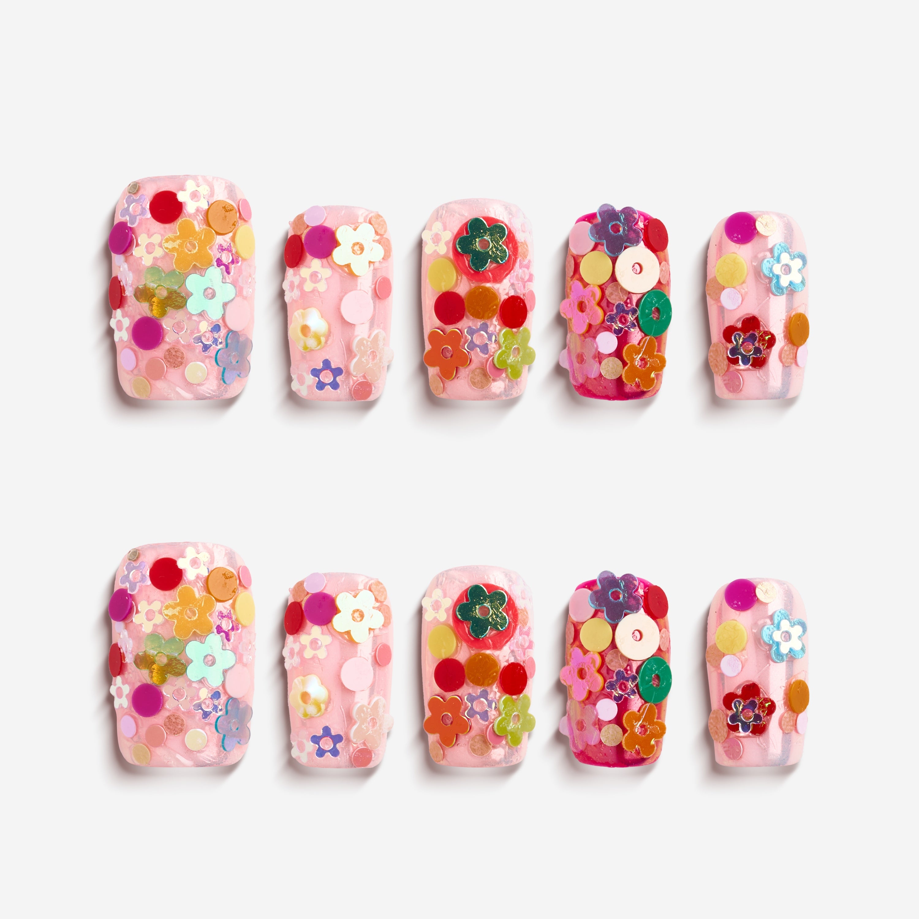 Colorful floral press on nails featuring 3D flower embellishments. Bold, fun and reusable nail set.