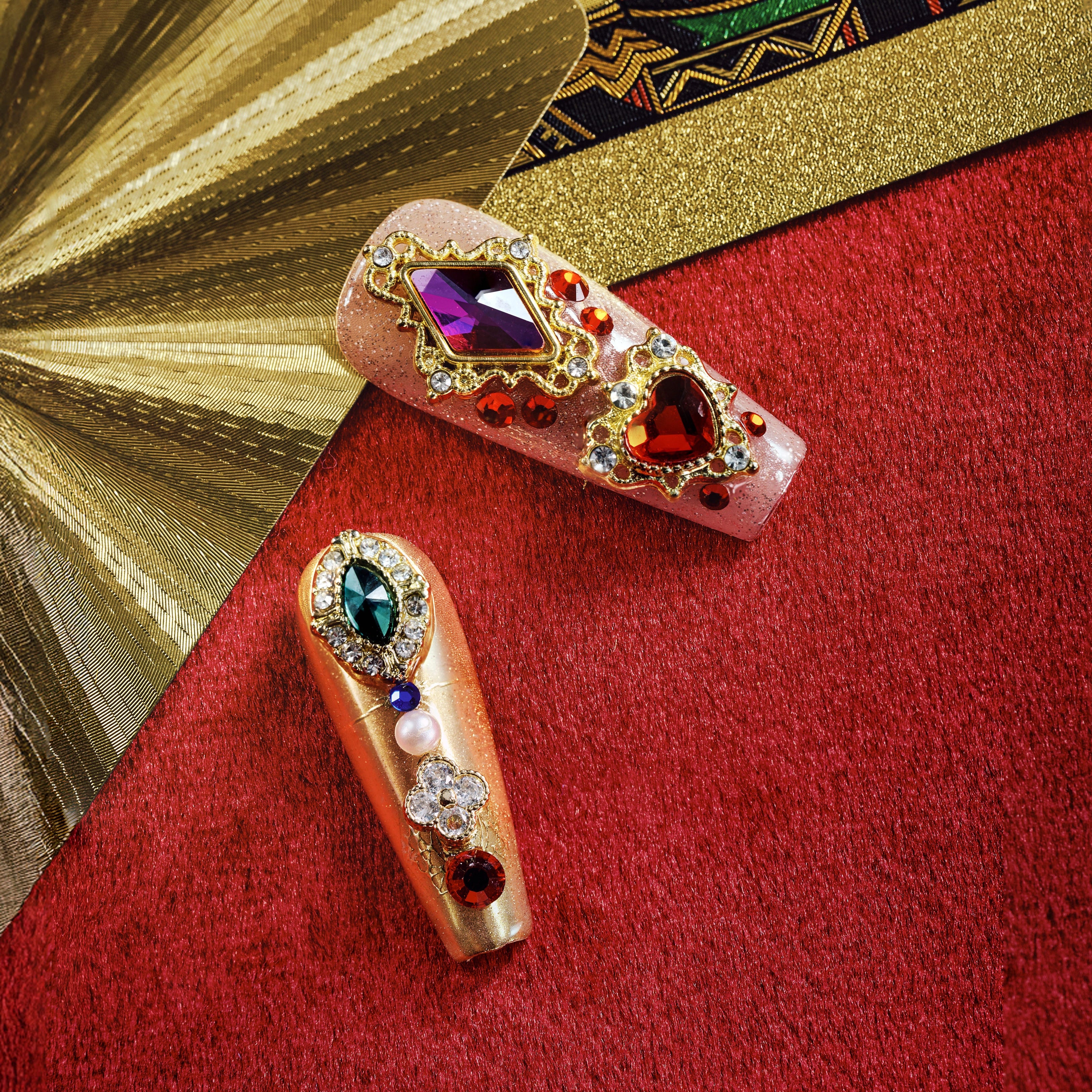 Royal-inspired luxury press on nails with ornate gemstone details. Handmade reusable nail art set with elegant impact.