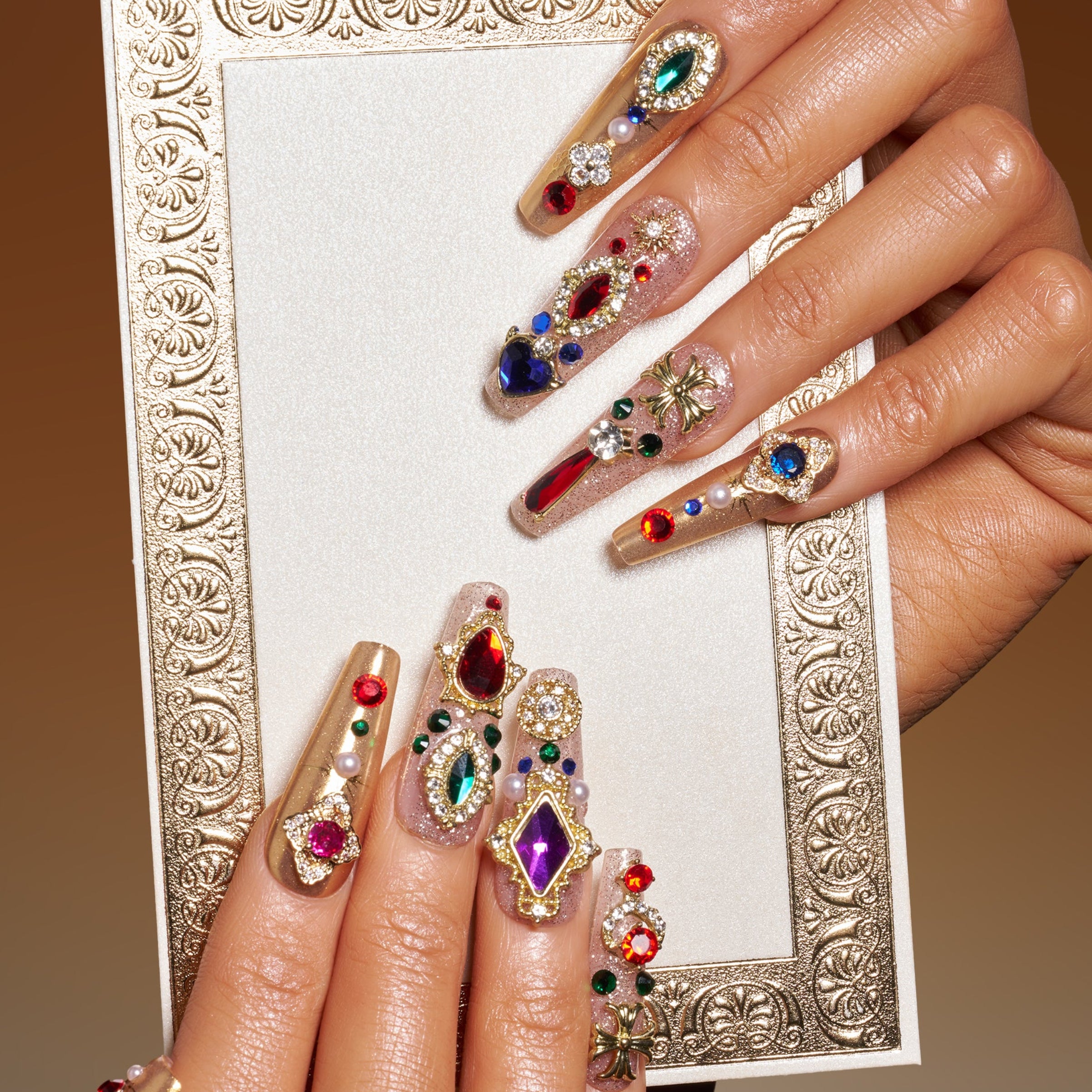 Royal-inspired luxury press on nails with ornate gemstone details. Handmade reusable nail art set with elegant impact.