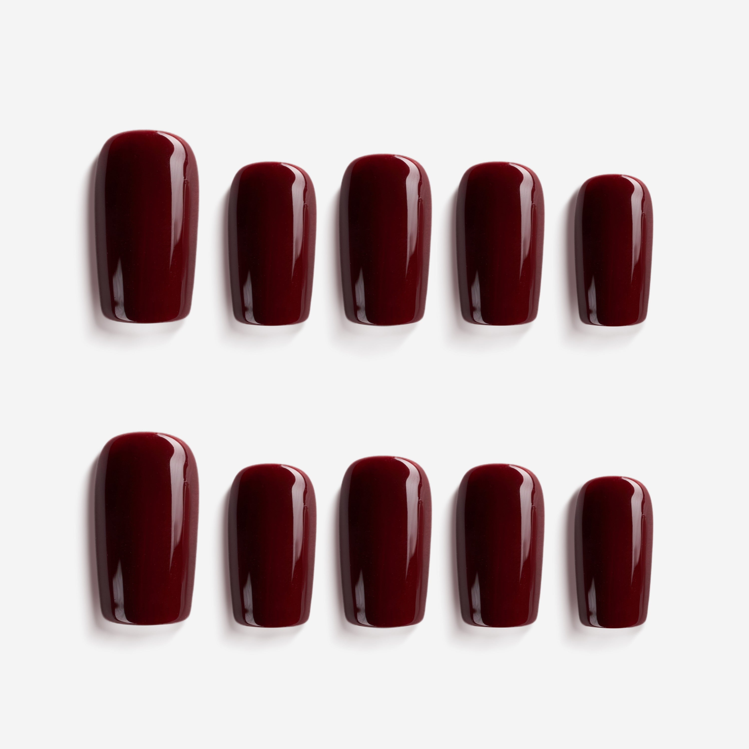 Crimson Temptation glossy red press on nails. Bold, rich statement false nails for glam nights.