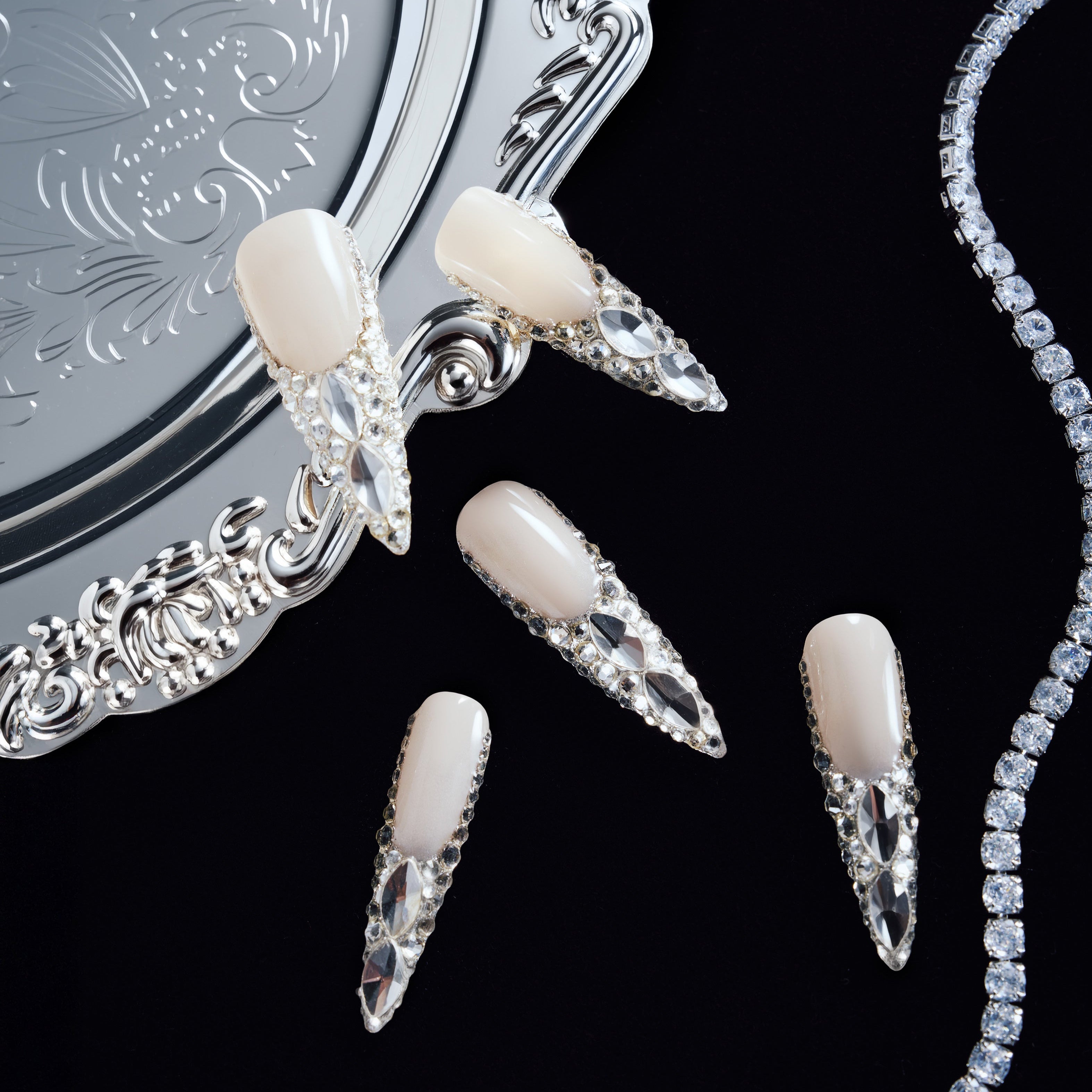 Crystal Wings luxury press on nails featuring premium Swarovski® crystals. Handmade reusable nail art set with dramatic shine and elegant nude base.