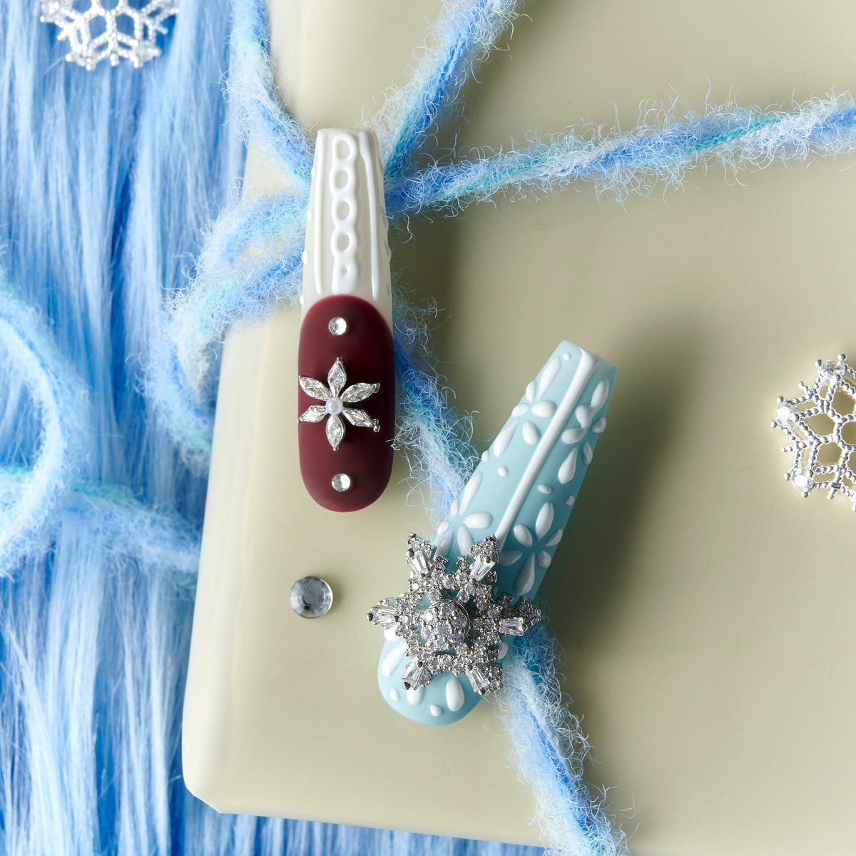 Dance of the Cosmos Christmas press on nails with 3D knit texture, snowflake charms, red and blue winter design long nail