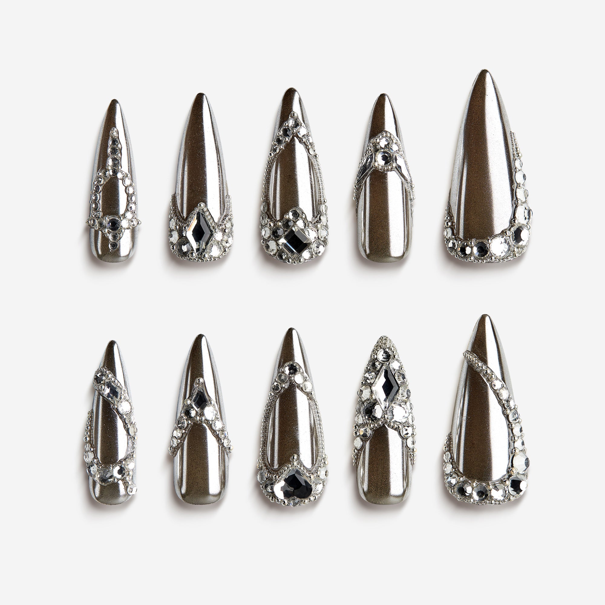 Diamond Satin Glow press-on nails with chrome silver finish and crystal rhinestone decorations