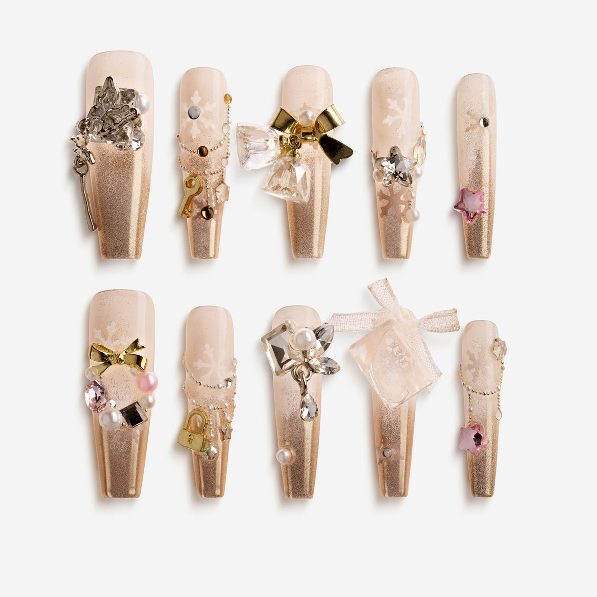 Champagne Snow Veil – pearl champagne Christmas nails with snowflake accents and crystal charm details