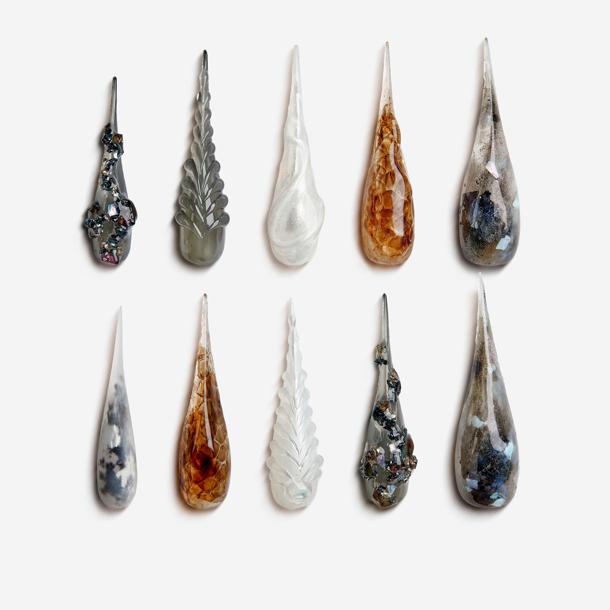 Horns of the Deep – metallic gray and amber marble press-on nails with deep-sea horn inspired 3D design for Halloween