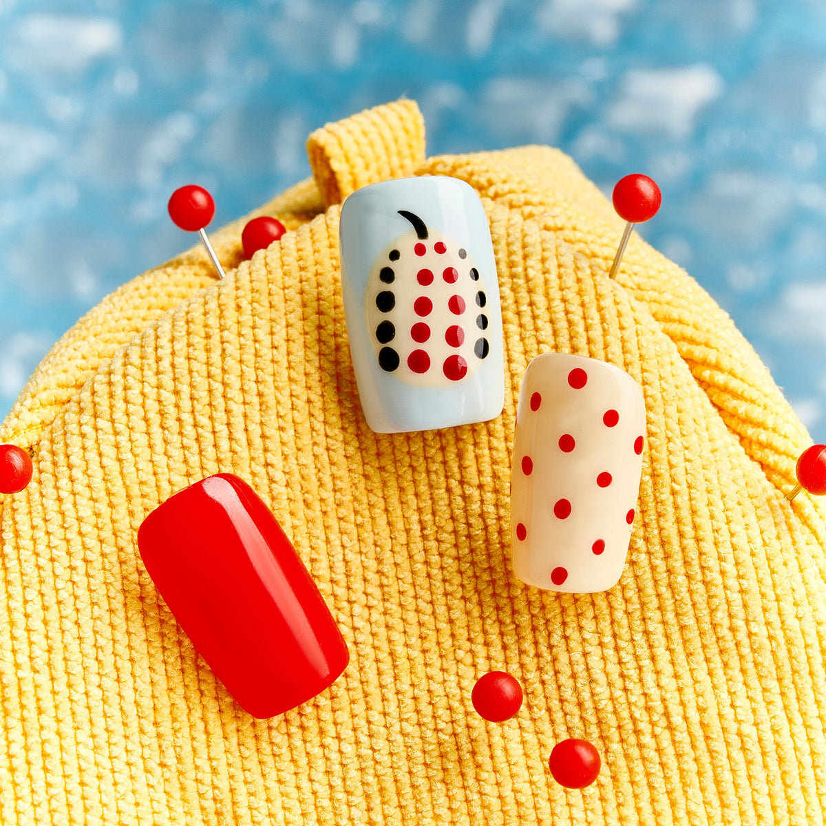 Polka Dot Cherry – red polka dot Christmas press-on nails with pearl cherry details and playful retro look
