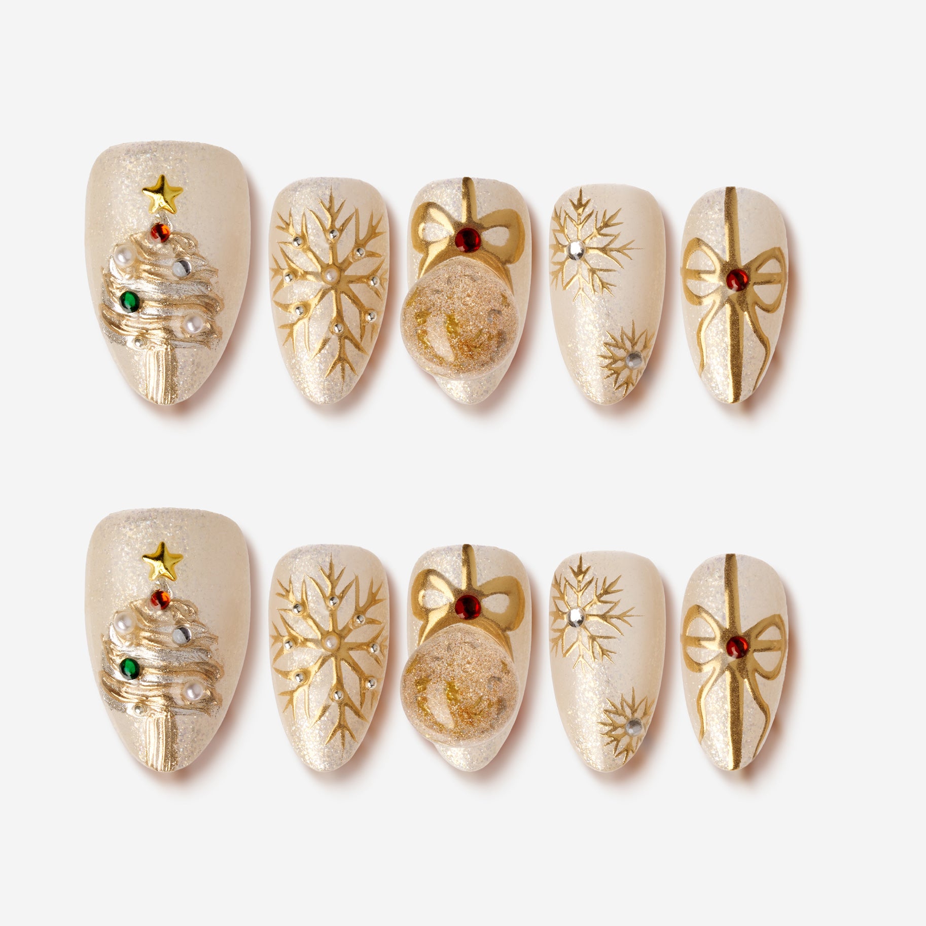 Shining Star Wishes – gold champagne press-on nails with Christmas tree, ribbon, and snowflake designs