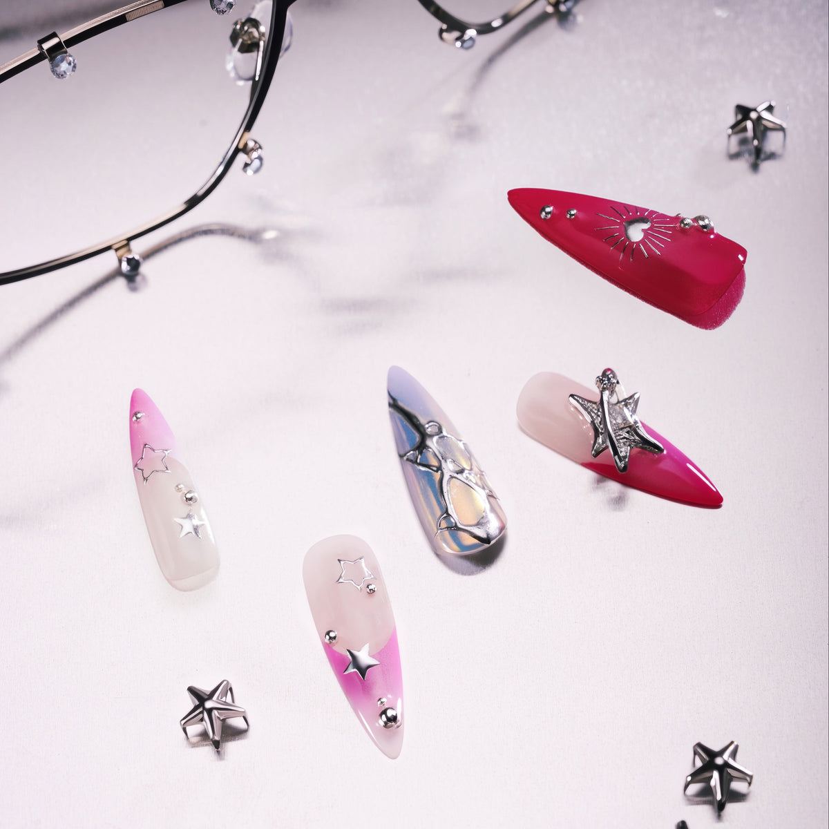 Stellar Bloom – pink gradient press-on nails with silver star and chrome accents