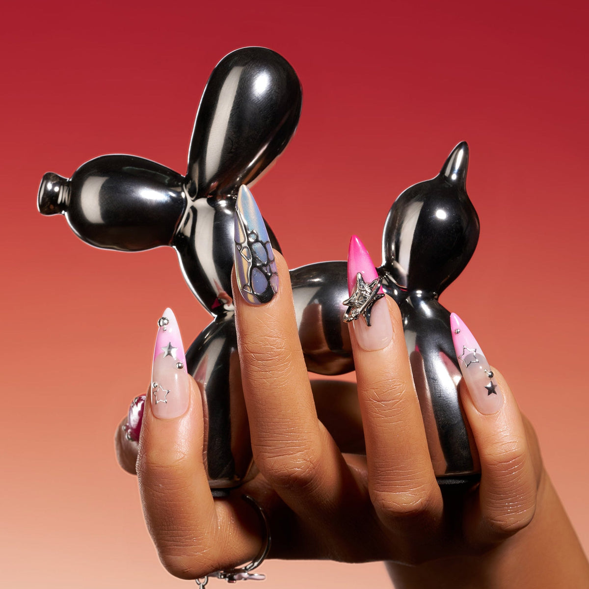 Stellar Bloom – pink gradient press-on nails with silver star and chrome accents