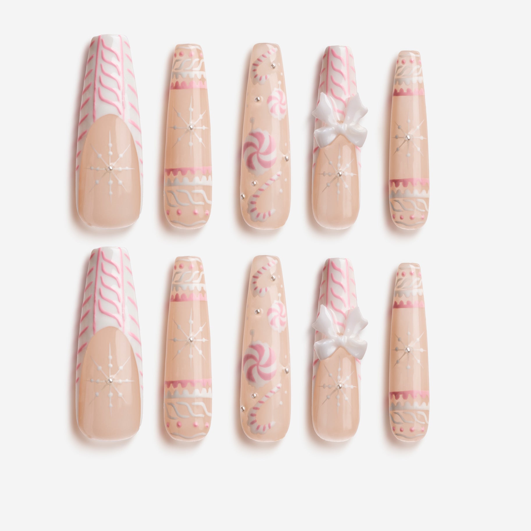 Sweet Snow Charm – pink Christmas press-on nails with snowflake, candy, and bow decorations