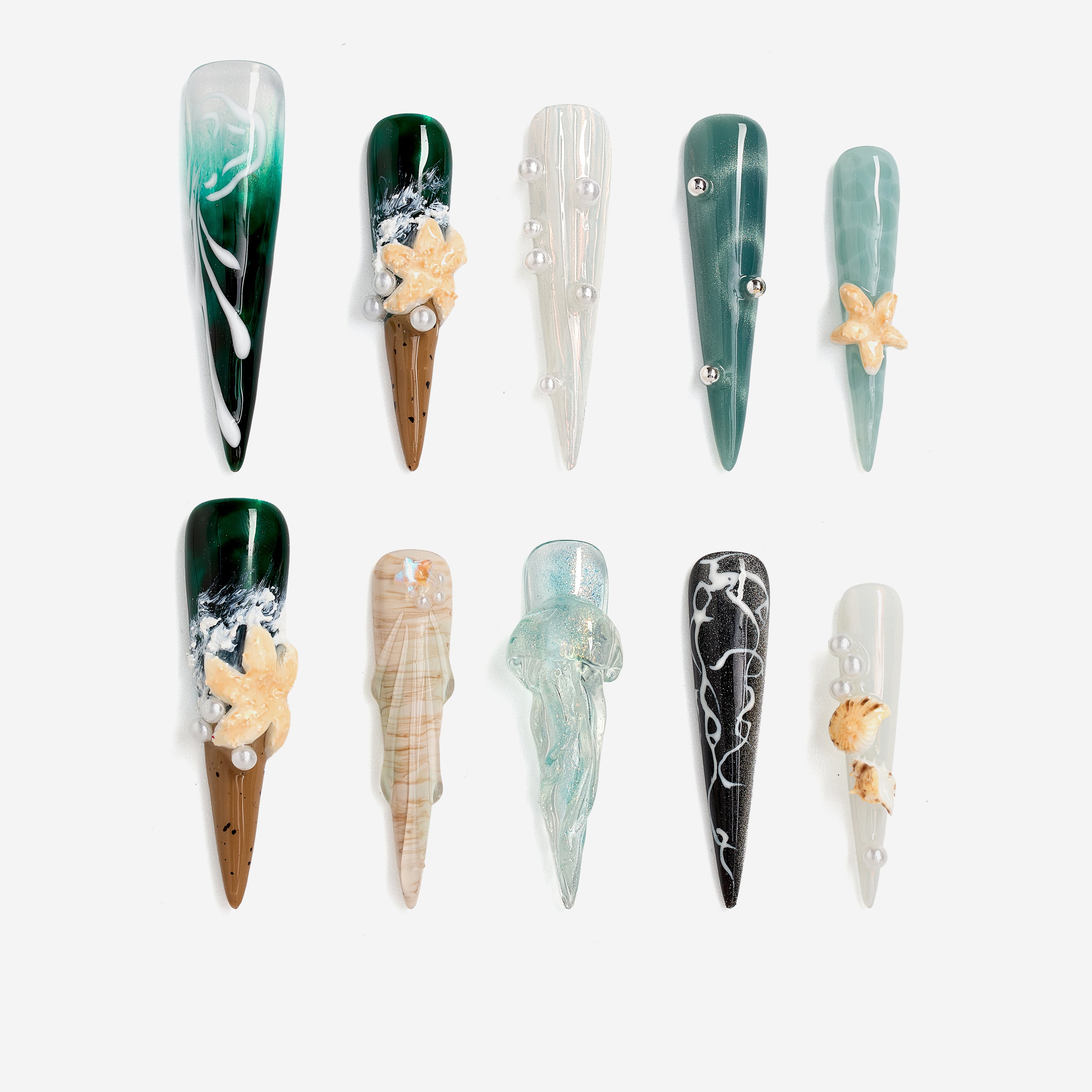 Dresup Ocean Mystique press on nails with green gradient and 3D sea elements. Statement stiletto false nails.
