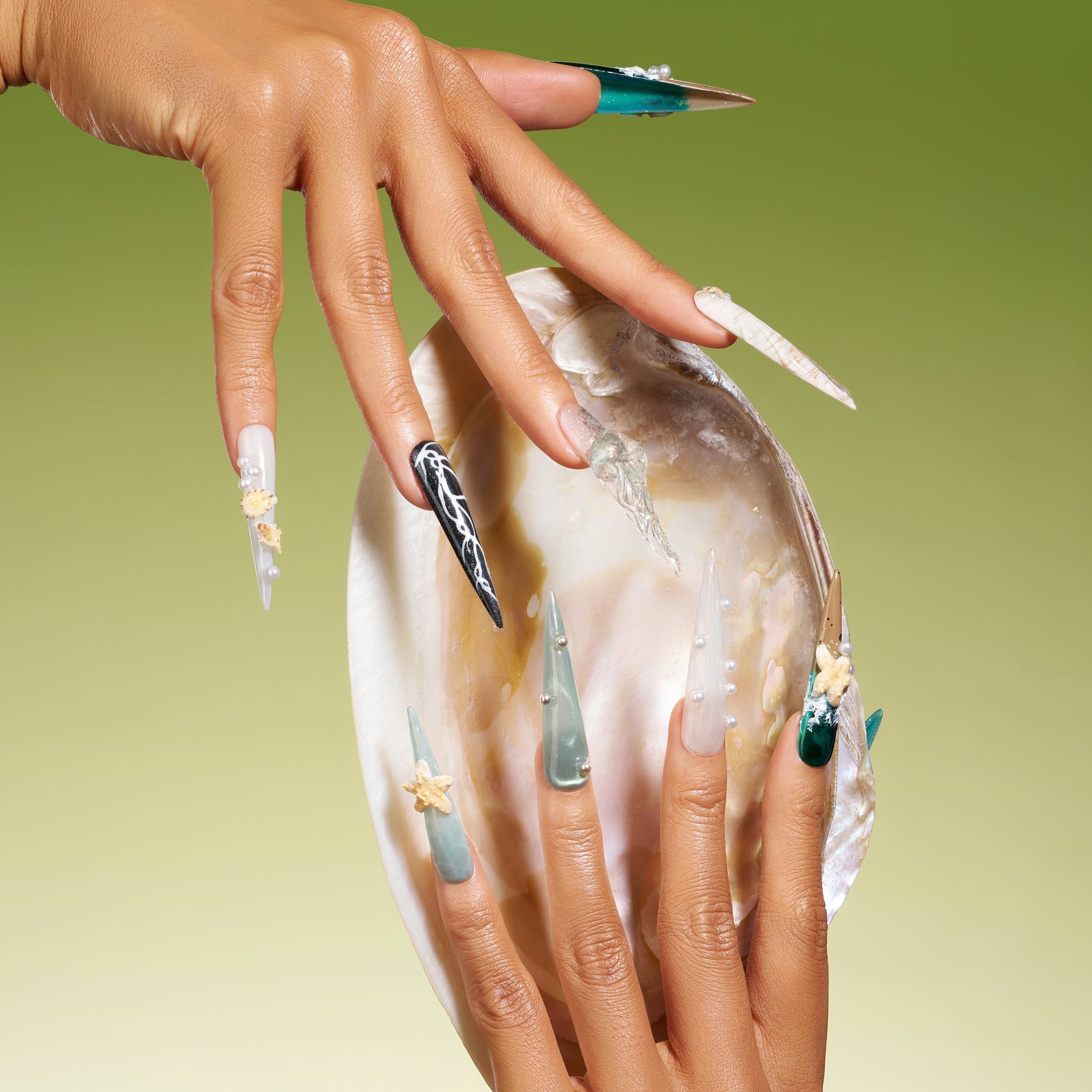 Dresup Ocean Mystique press on nails with green gradient and 3D sea elements. Statement stiletto false nails.