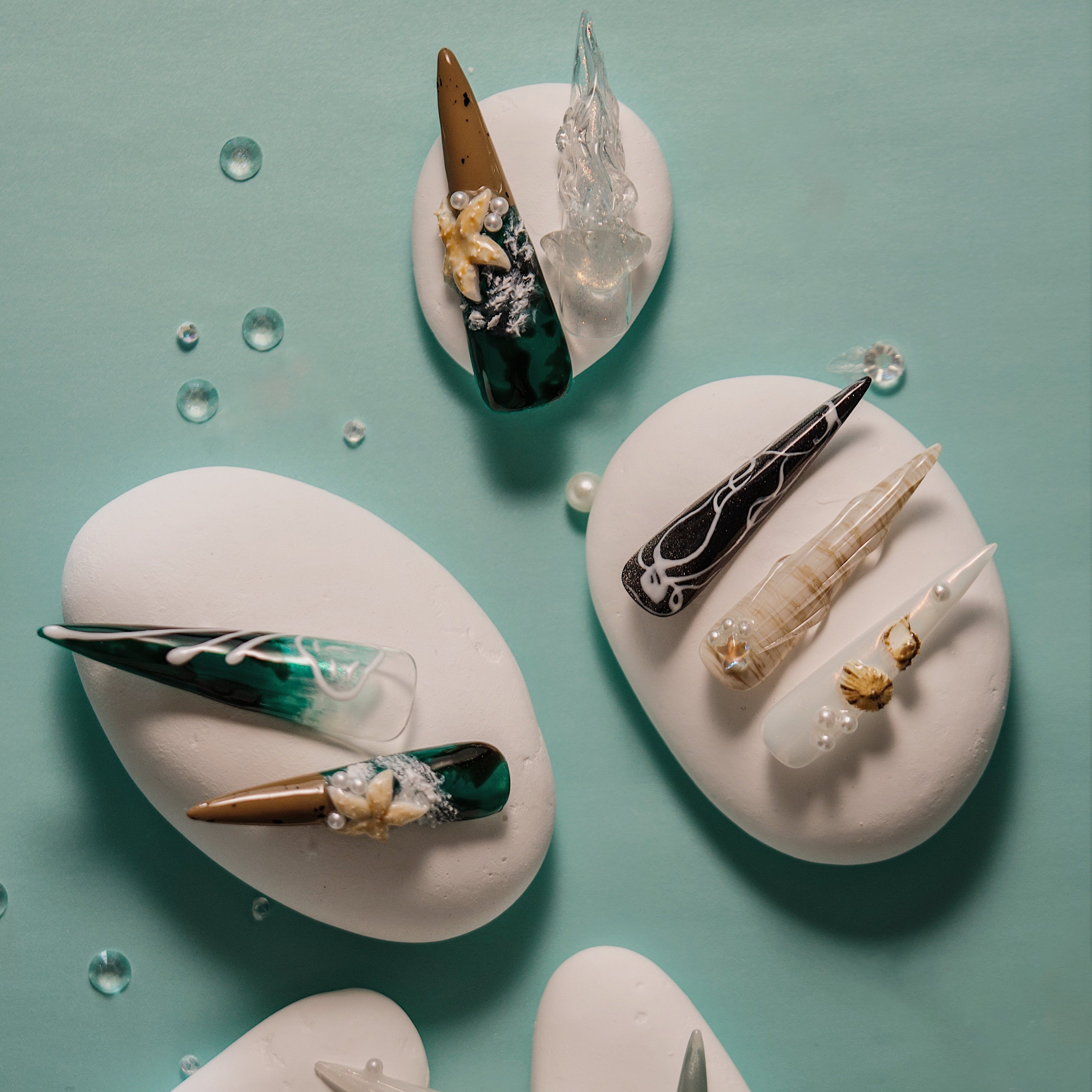 Dresup Ocean Mystique press on nails with green gradient and 3D sea elements. Statement stiletto false nails.