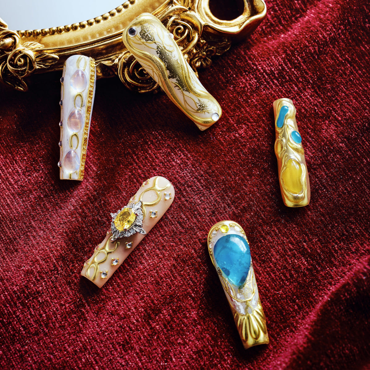 Luxury gold and turquoise gemstone press on nails with sculpted metal texture and jewel accents