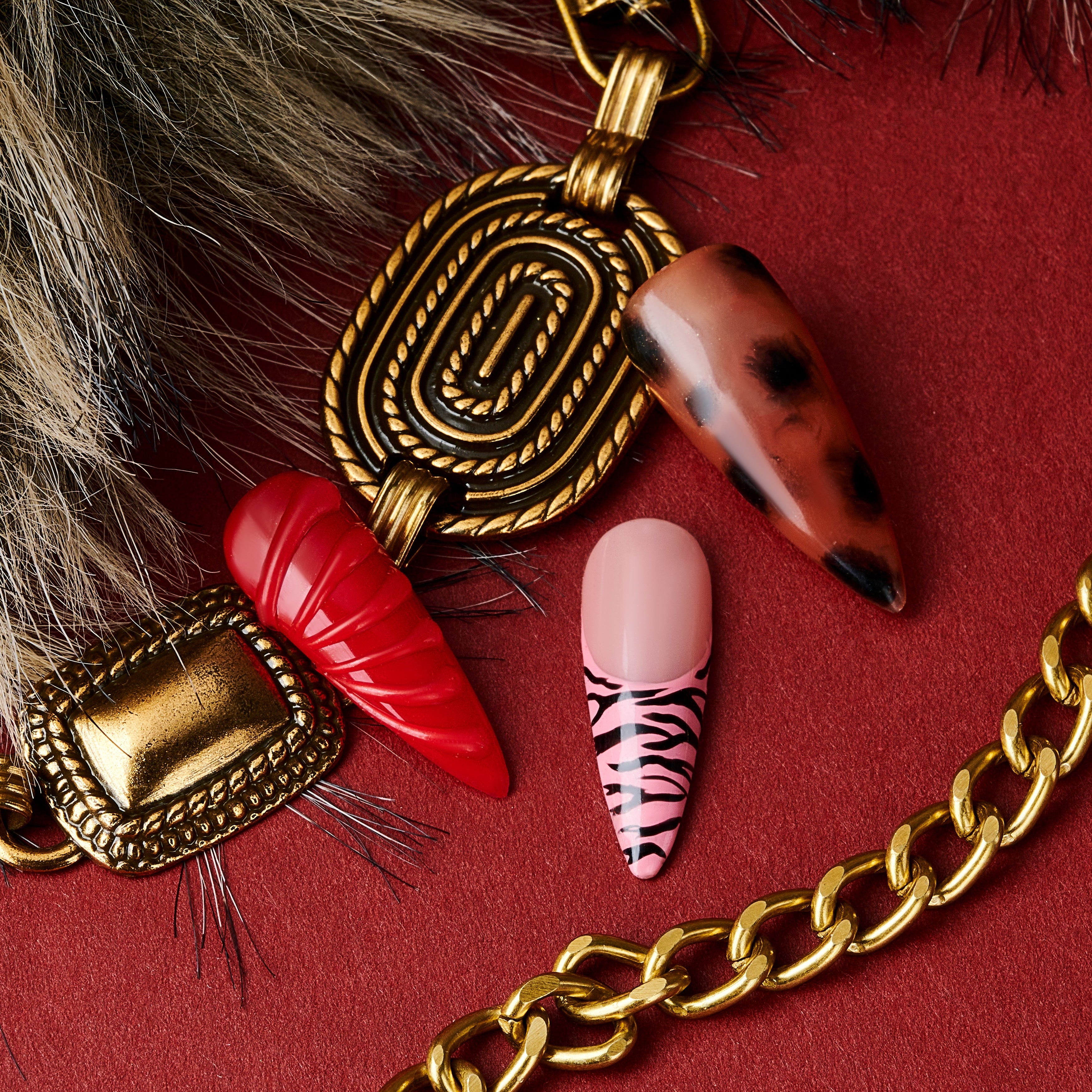Fiery Flow press on nails with red marble, animal print, and gold-frame accents