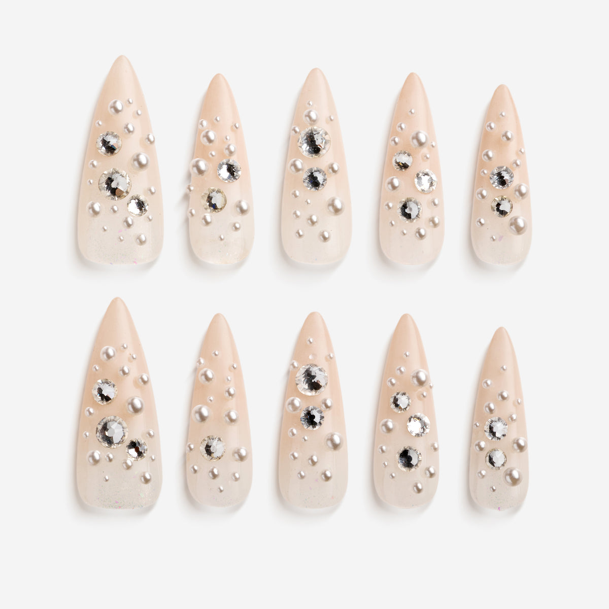 Nude press on nails with pearl and rhinestone clusters for soft luxury style