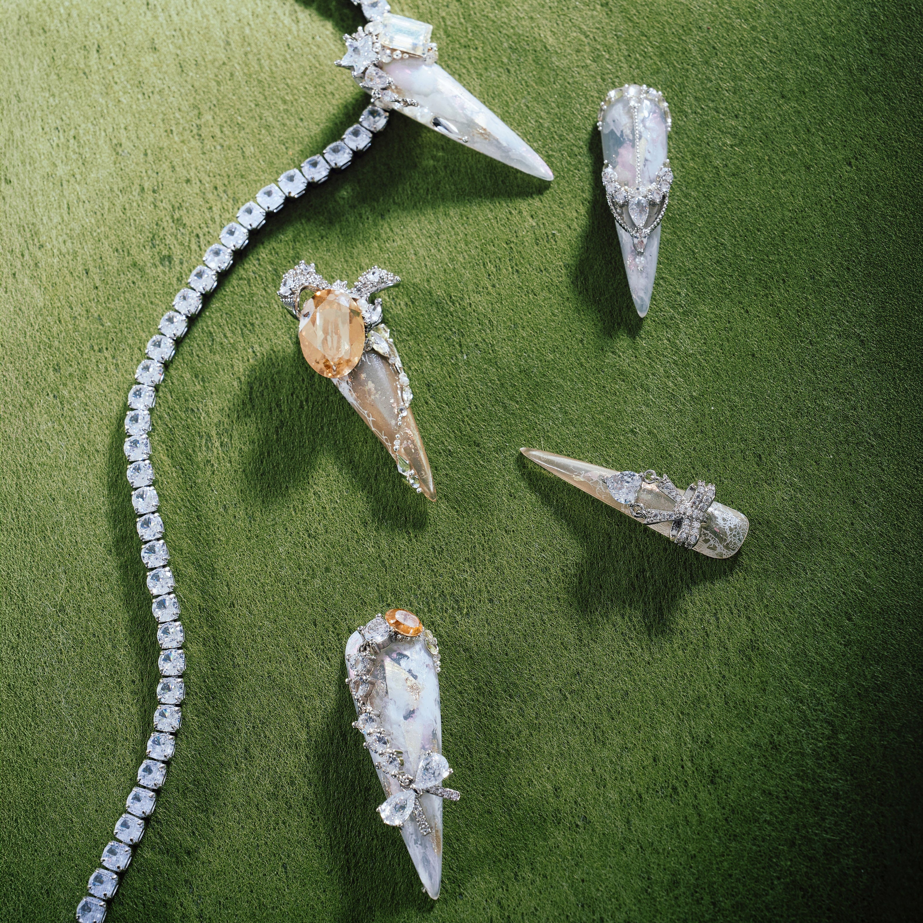 Glittering Illusion luxury press on nails with pearls, crystals and iridescent gemstones on nude base