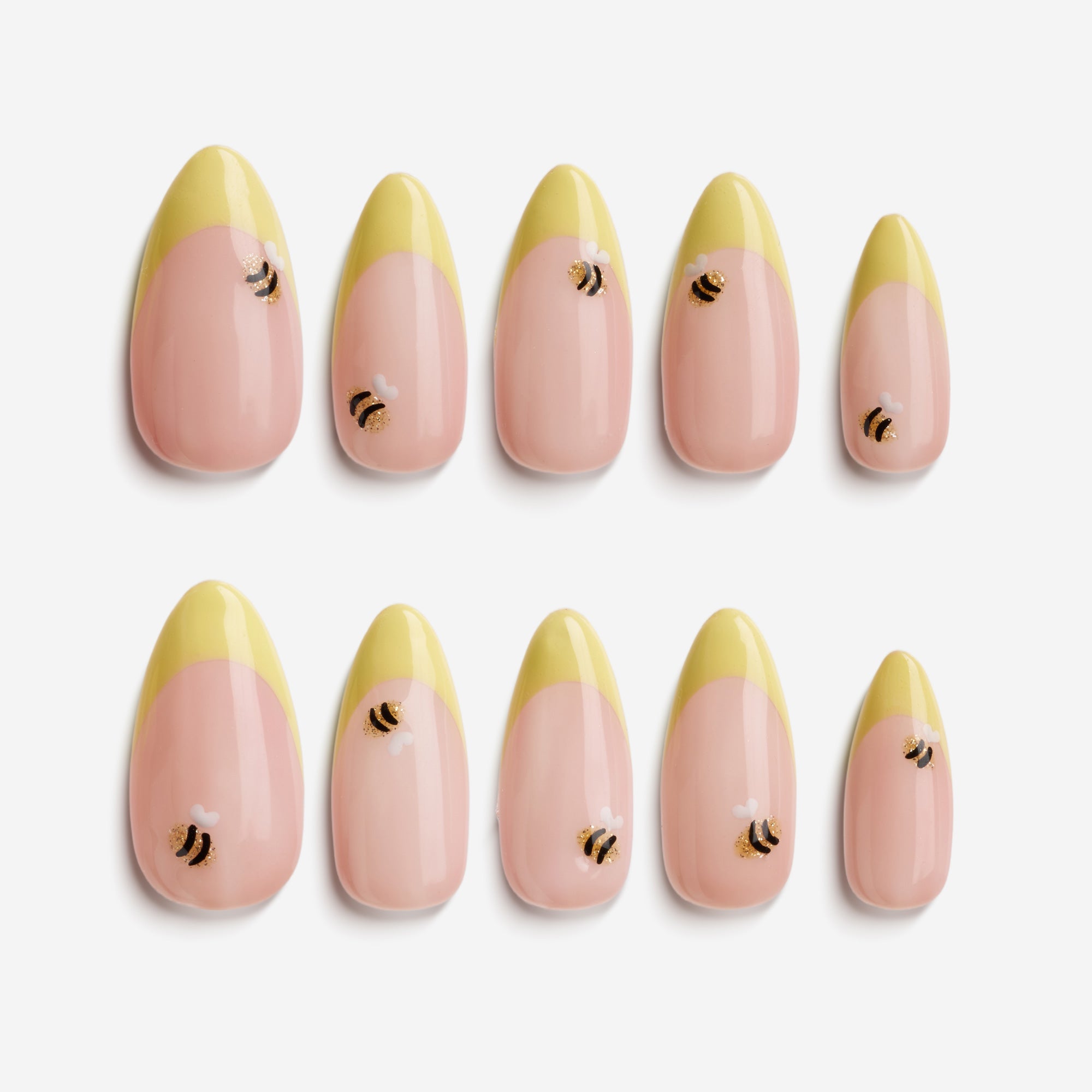 Golden Sunrise almond press on nails with yellow tips and tiny bee accents