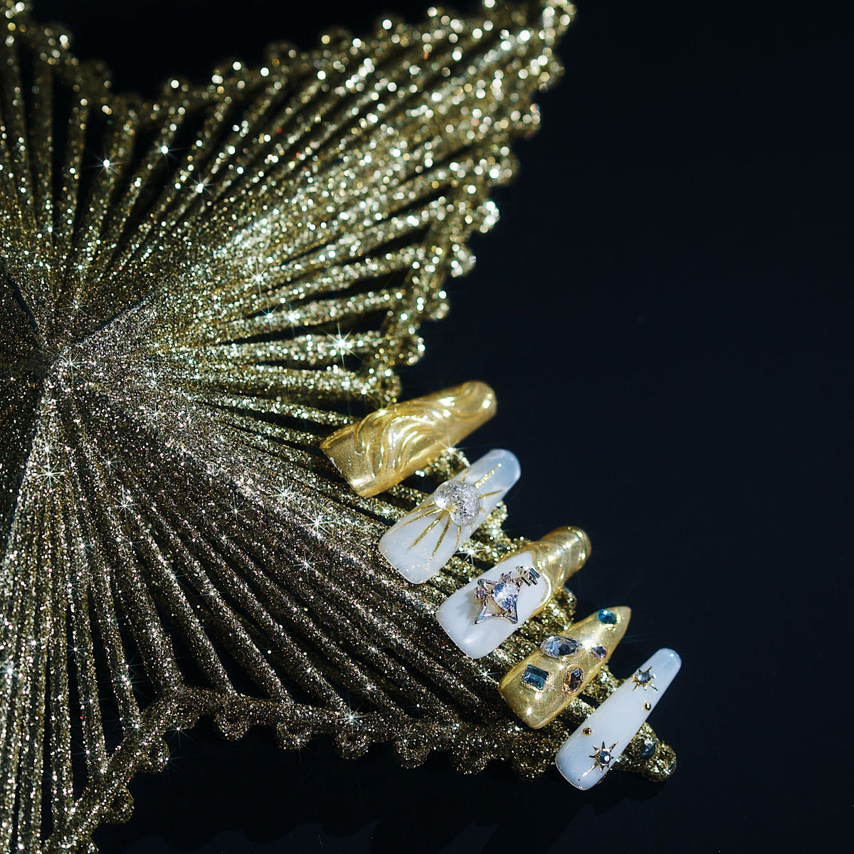 Luxury gold chrome press on nails with crystal details. High shine, sculpted texture and reusable glam design.