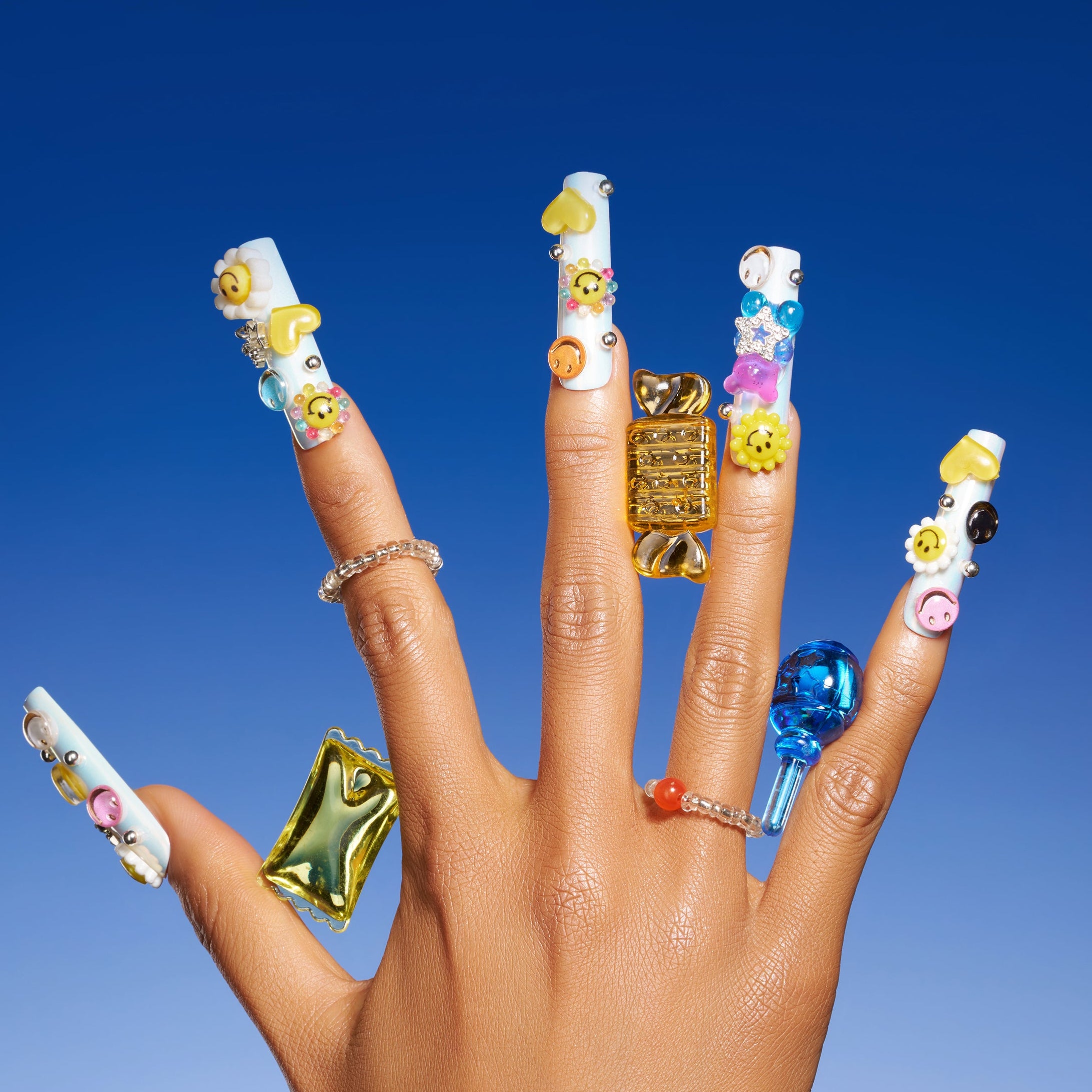 Colorful smiley face 3D press on nails in playful Y2K style. Reusable handmade nail art set.