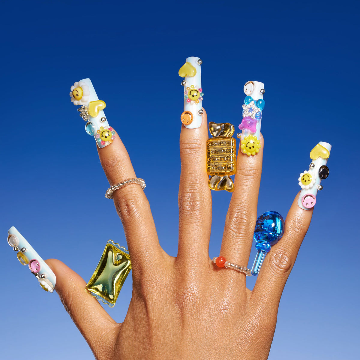 Colorful smiley face 3D press on nails in playful Y2K style. Reusable handmade nail art set.