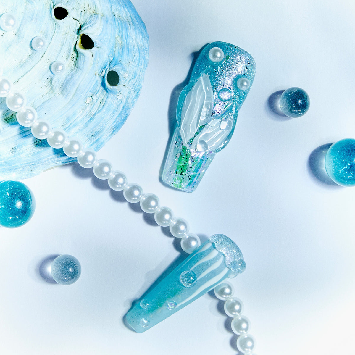 Ice Sea Fairy press-on nails with blue gradient, pearl accents, and 3D ocean-inspired textures