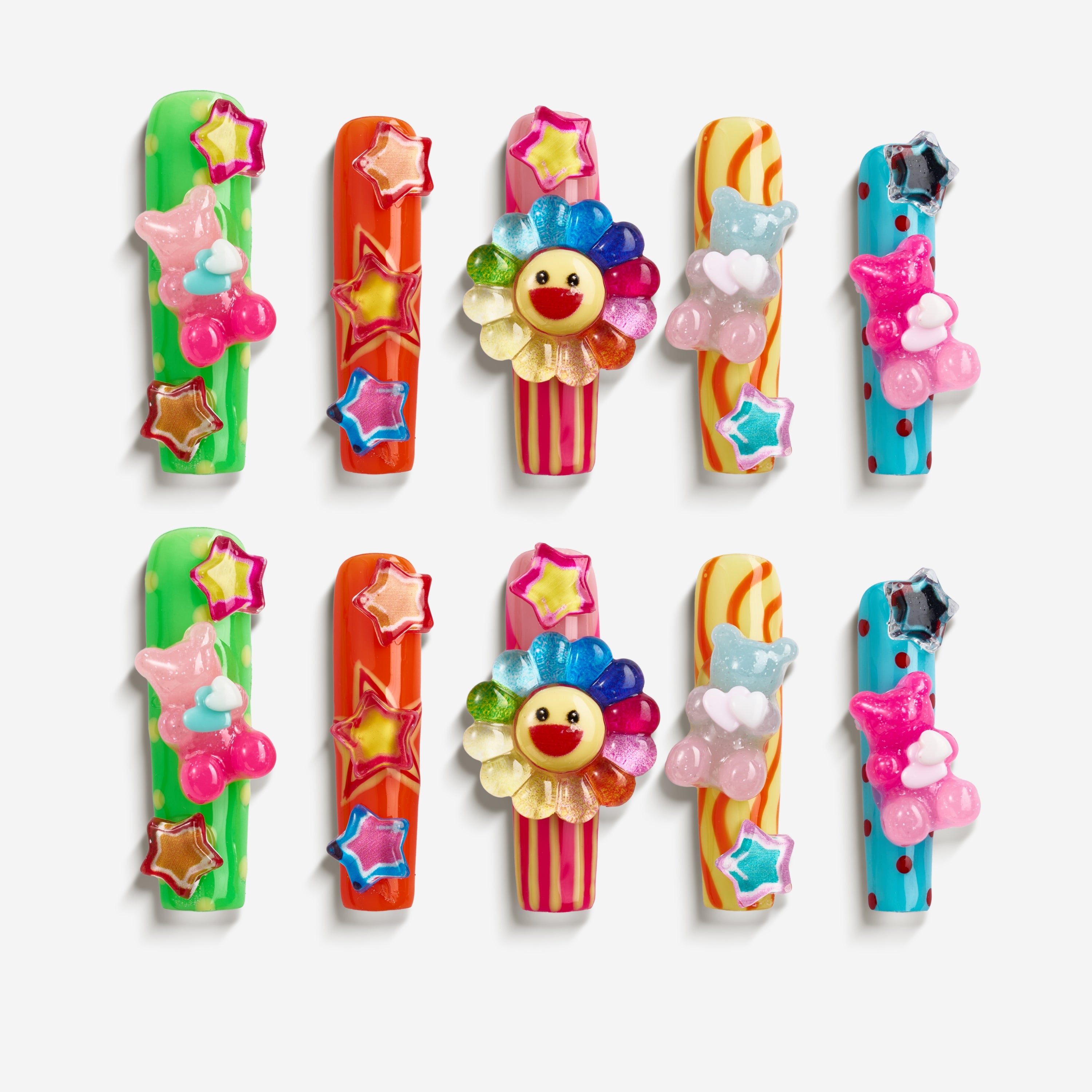 Colorful 3D press on nails with star and teddy details. Bold, playful and reusable.