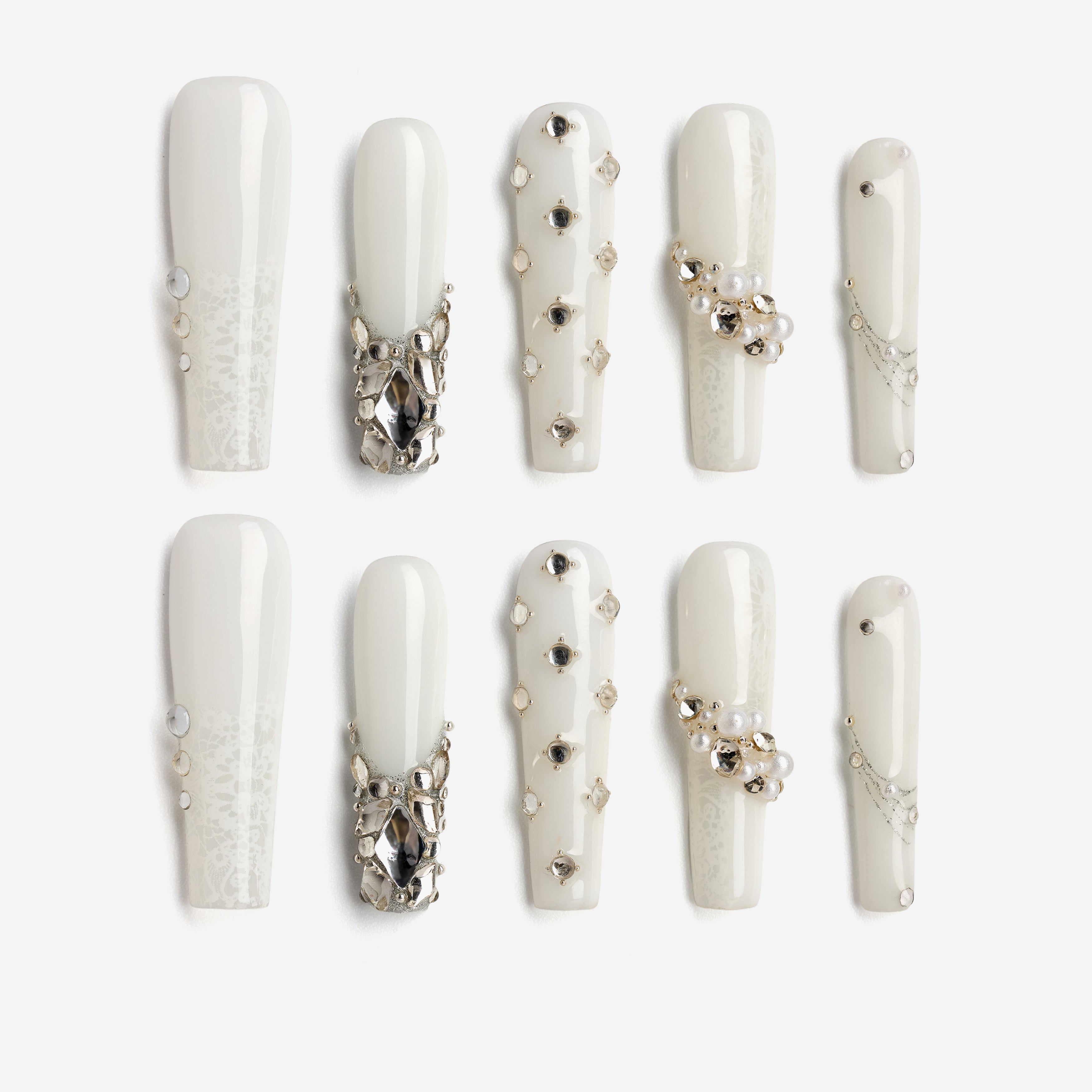 Romantic pink press on nails with crystal heart accents. Glossy finish and reusable salon-quality design.