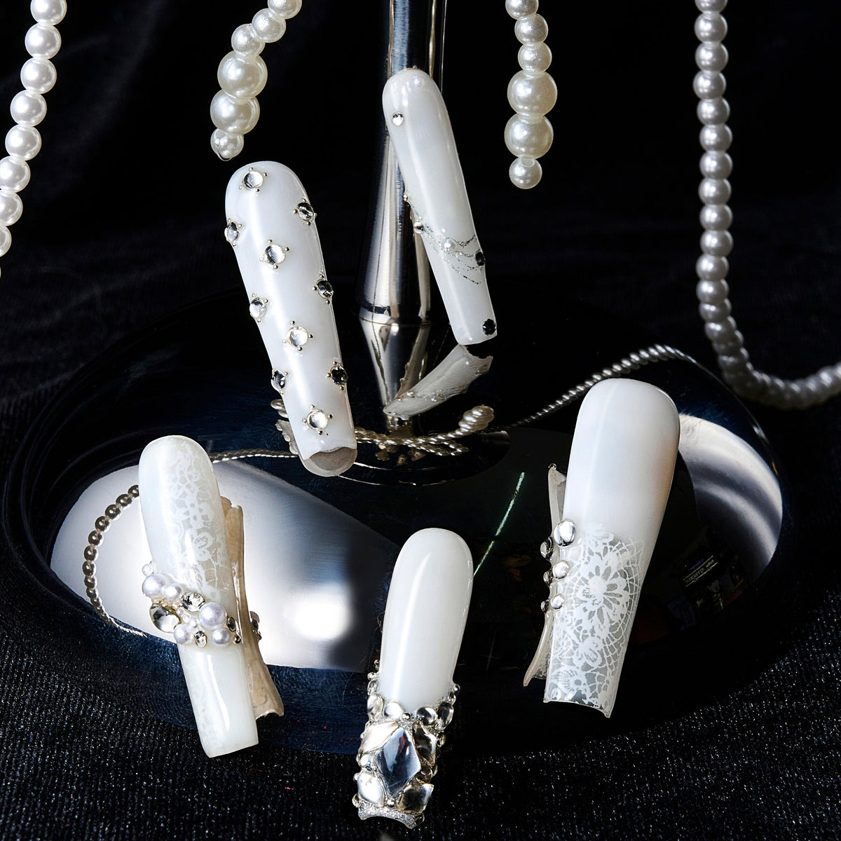 Romantic pink press on nails with crystal heart accents. Glossy finish and reusable salon-quality design.