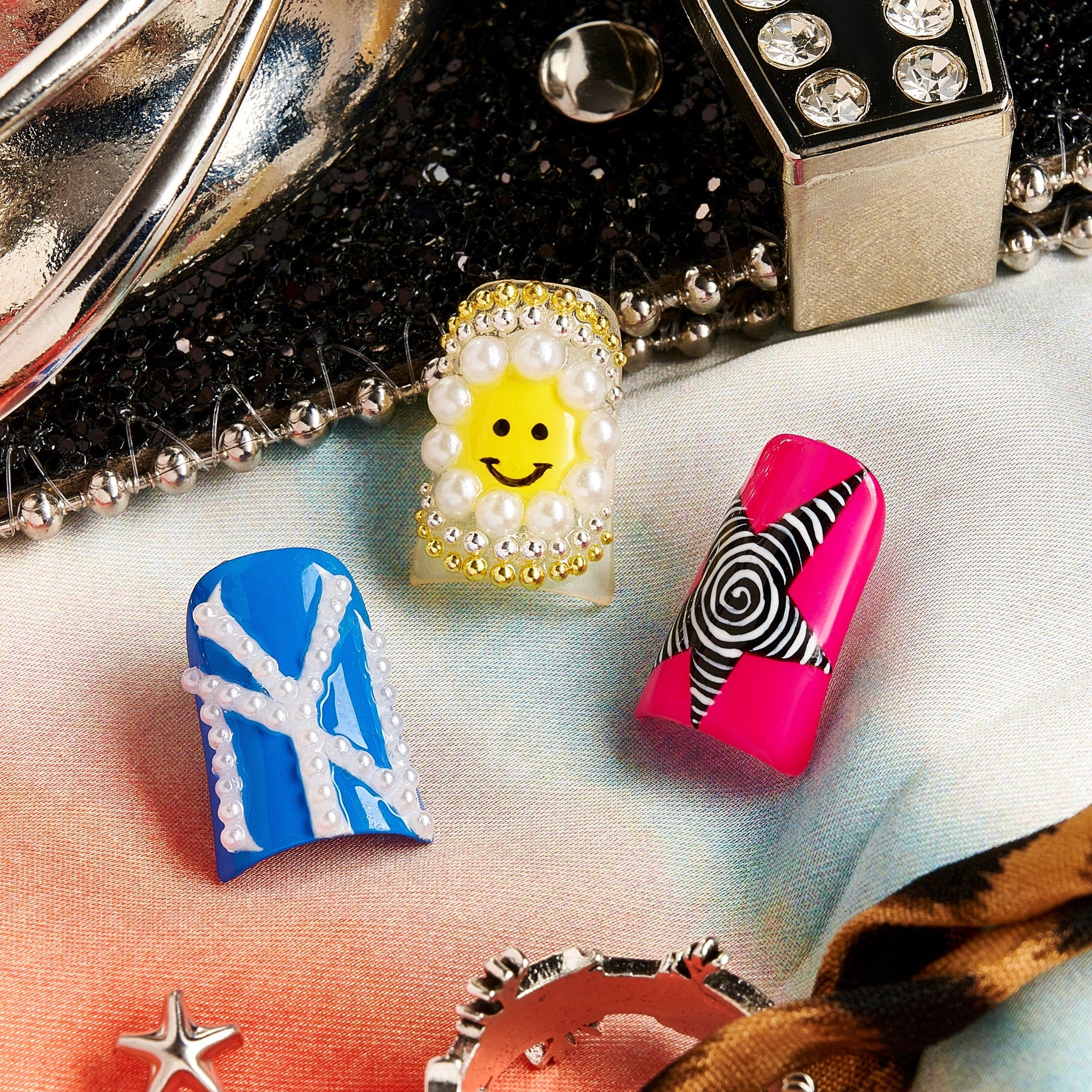 Modern Artbeat press on nails with mixed graffiti, pearls, symbols, and playful icons
