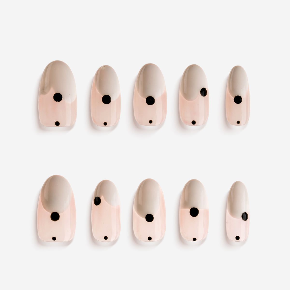 Minimal nude press on nails with black dot detail. Modern monochrome manicure set.