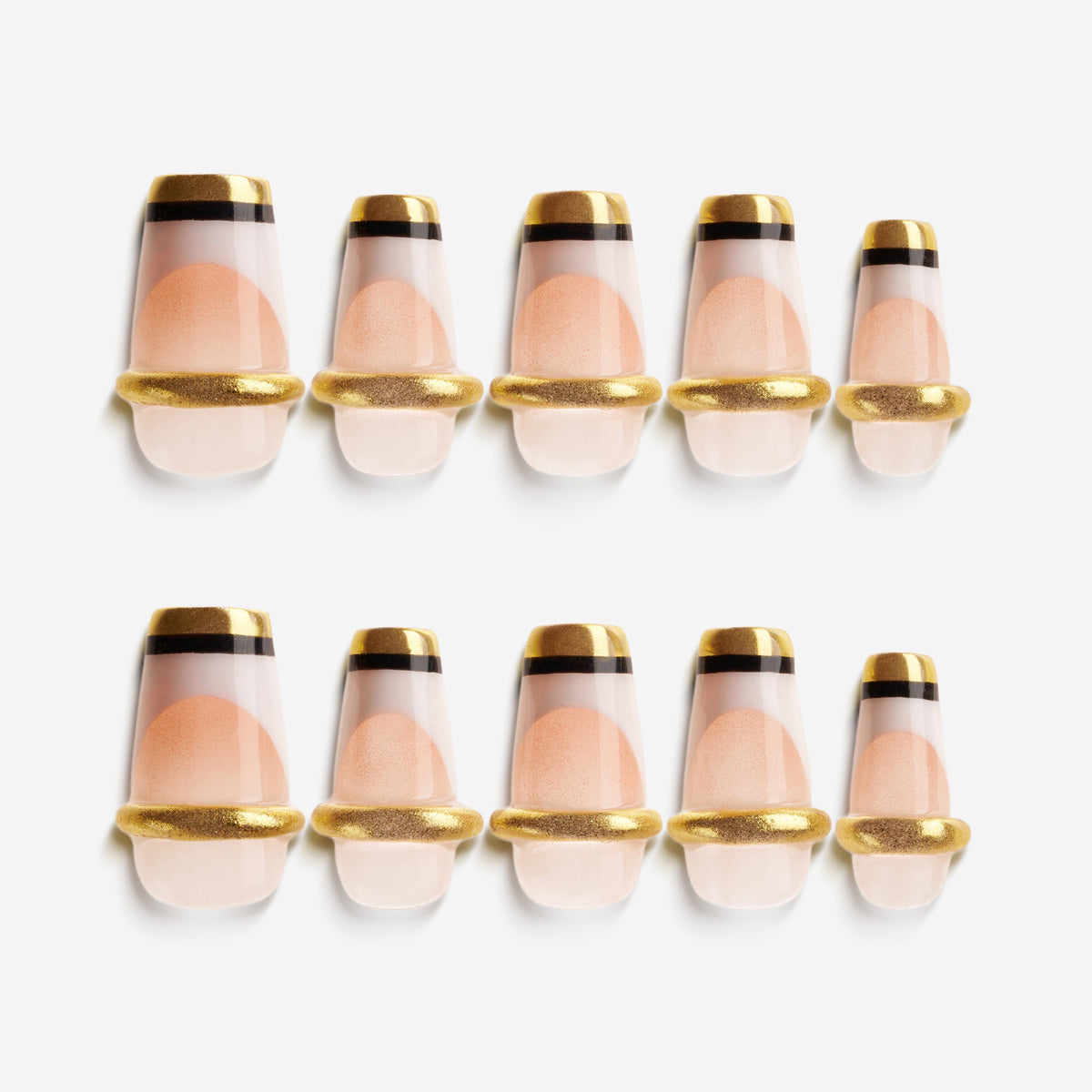 Nude Glow Trim press on nails with gold capsule-style French design