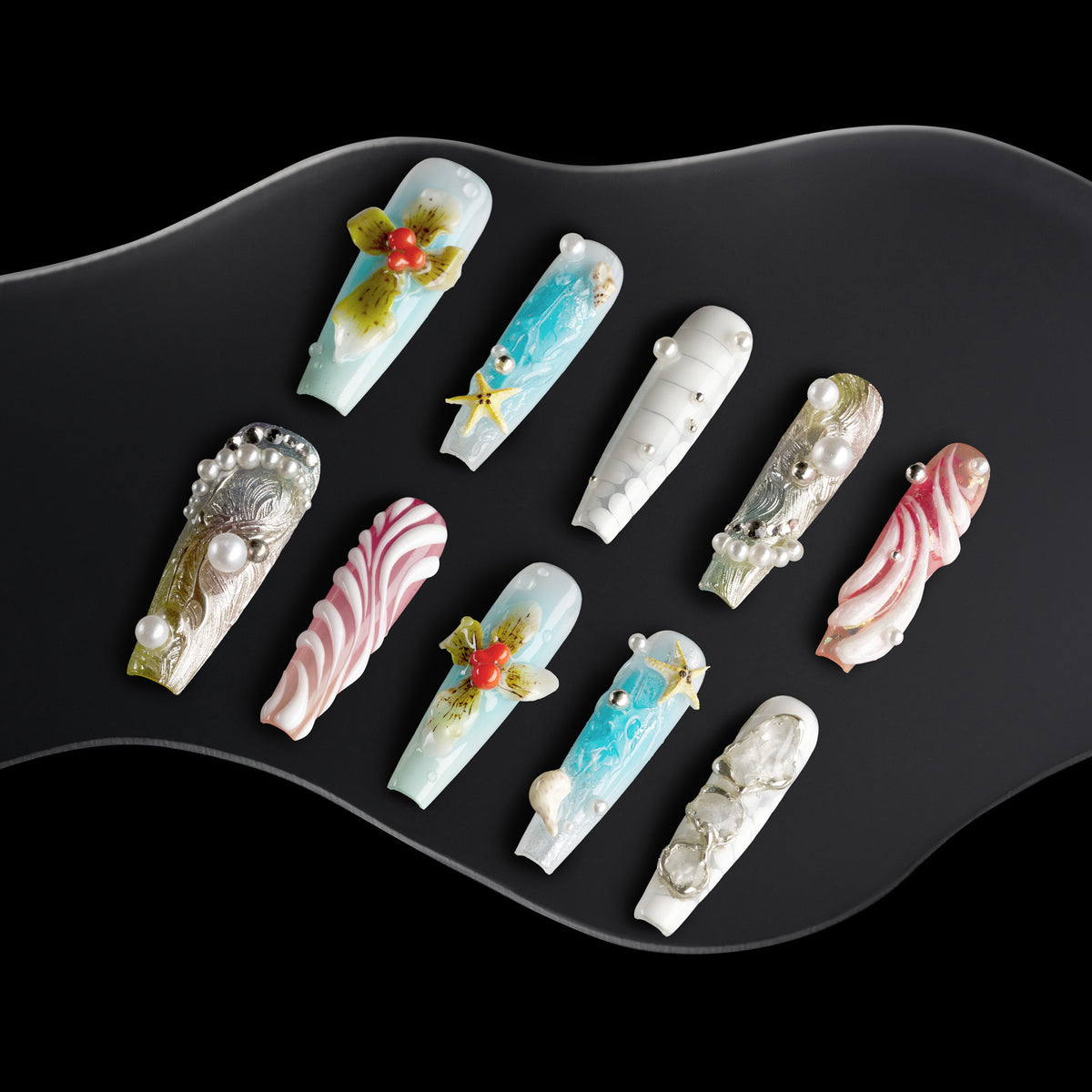 Oceanic Enchantment press-on nails with seashell designs, starfish charms, coral accents, and pearl decorations