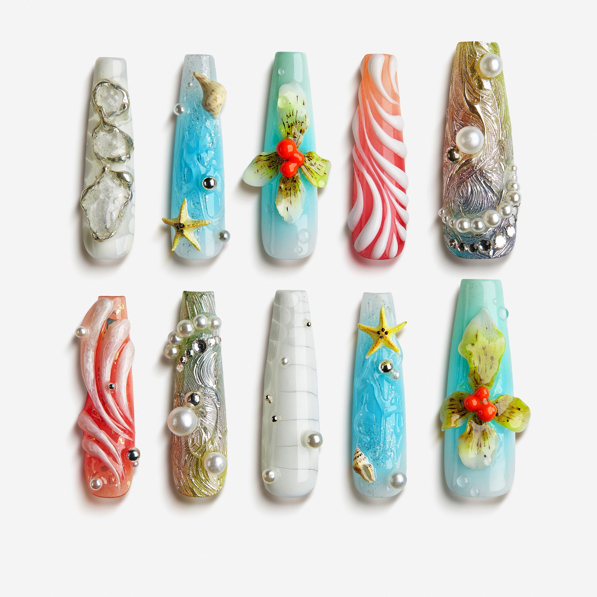 Oceanic Enchantment press-on nails with seashell designs, starfish charms, coral accents, and pearl decorations